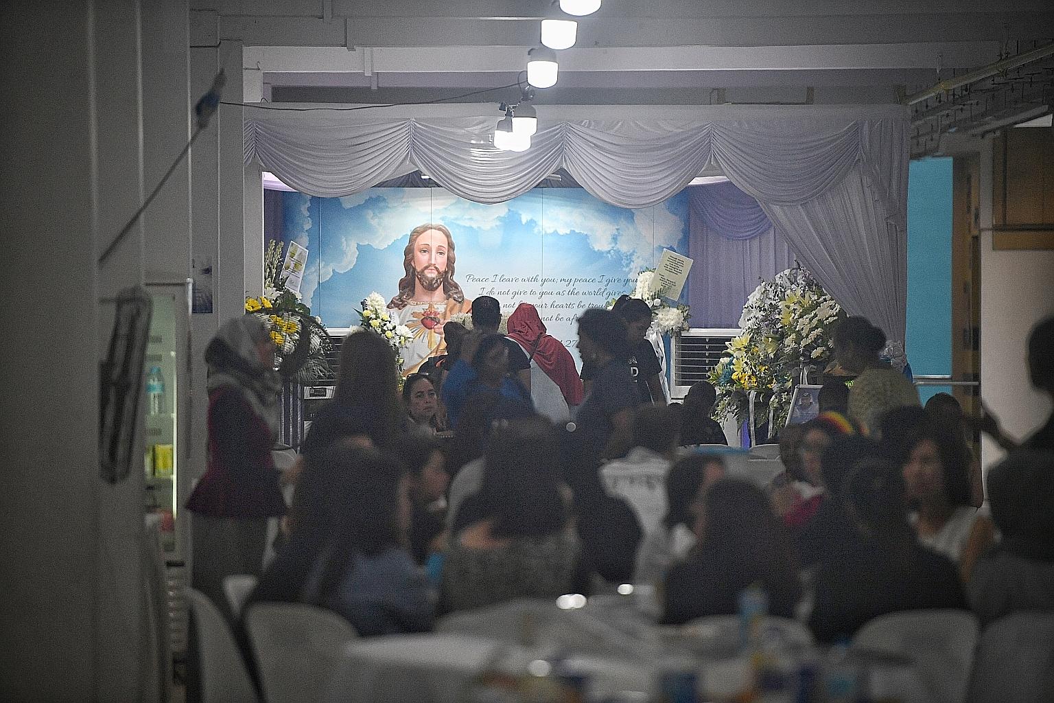 More than 40 friends and relatives attended the wake (above) of Mr Satheesh Noel Gobidass, who died after a brawl in Orchard Towers. Seven people, including one woman, have been charged with his murder.