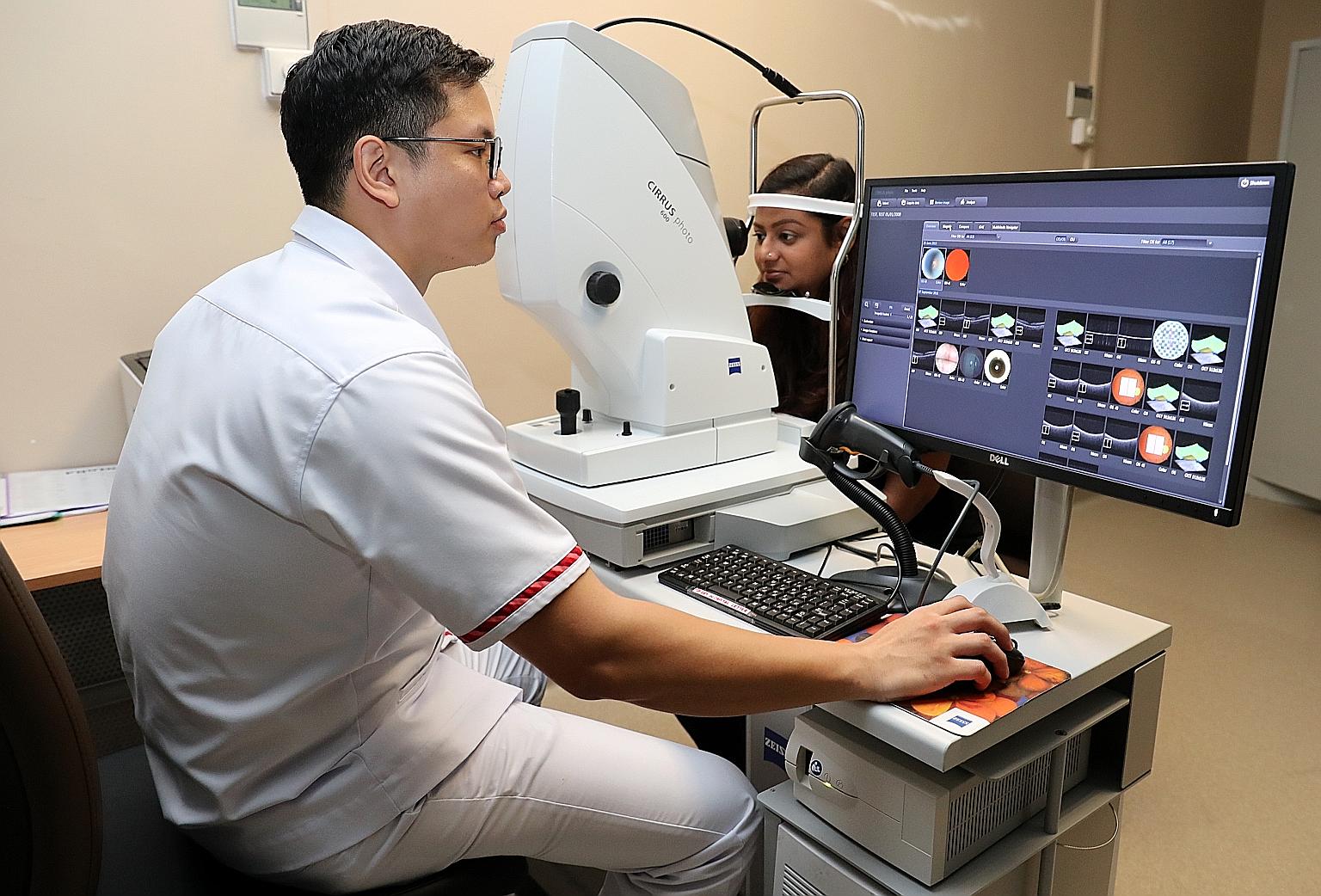 Enrolled nurse Abel Kwan (far left) using a specialised camera, known as a Fundus, at a mock screening session with the Selena+ AI. The system will address the need for increased manpower to tackle diabetes and related eye diseases.