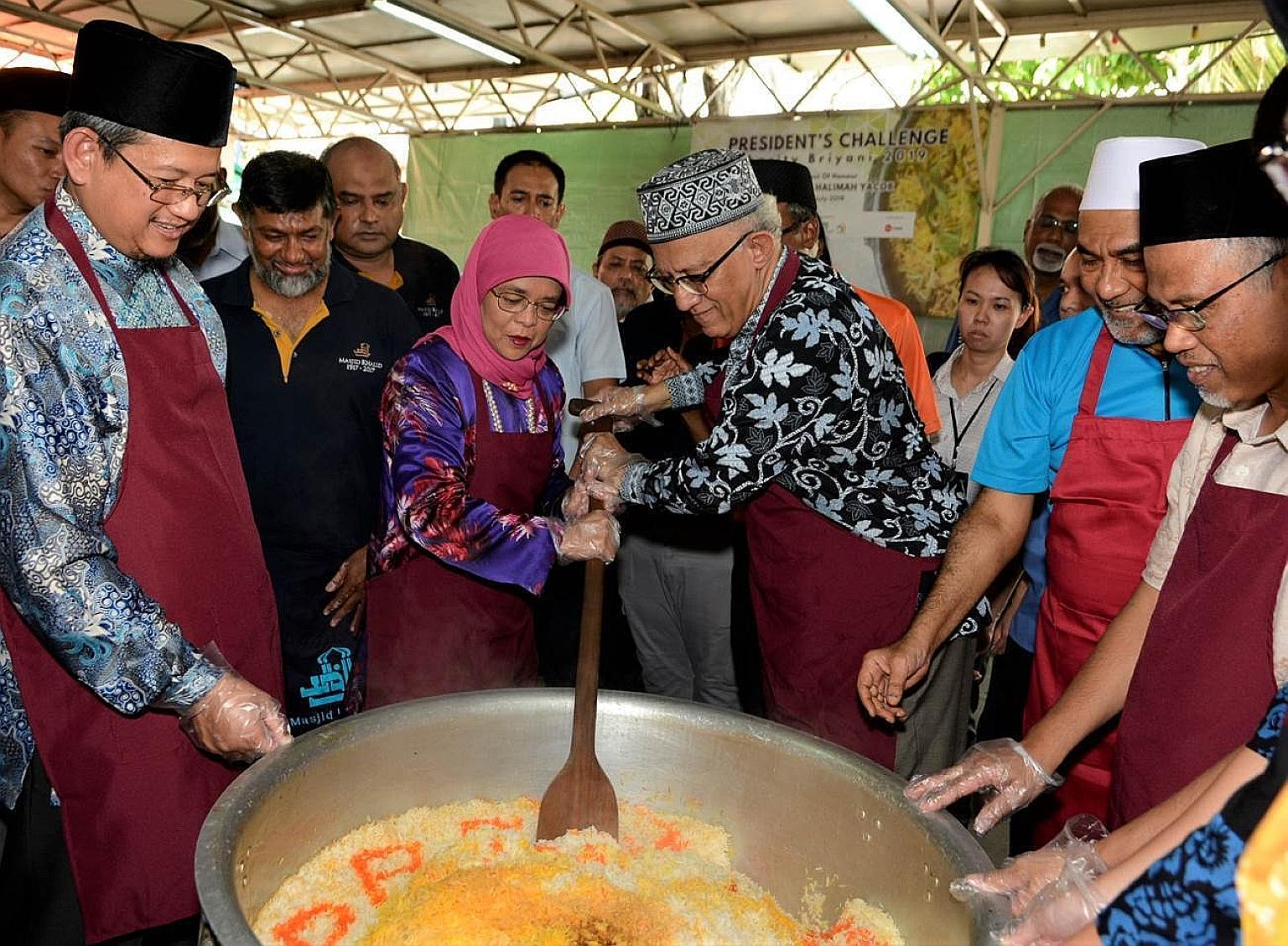 (From left) Mufti Fatris Bakaram, President Halimah Yacob, Mr Mohamed Abdullah Alhabshee, Masjid Khalid chairman Alla'udin Mohamed and Environment and Water Resources Minister Masagos Zulkifli at the President's Challenge Charity Briyani at Masjid Kh