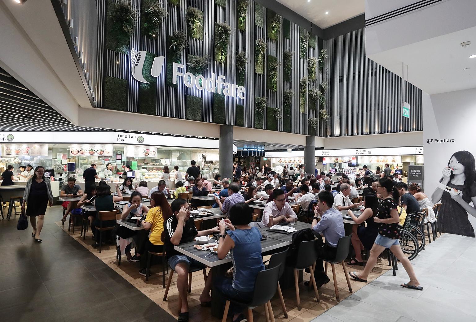 FairPrice, NTUC Foodfare (above) and Kopitiam will accept other forms of verification for Merdeka Generation discounts till July end. ST PHOTO: KELVIN CHNG