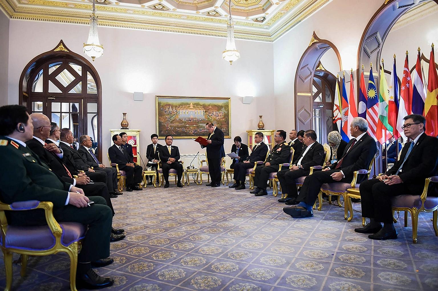 Thailand's Prime Minister Prayut Chan-o-cha (seated, centre) listening as his Defence Minister Prawit Wongsuwan speaks during a meeting of Asean defence chiefs and officials in Bangkok, during this year's meeting of regional defence ministers. PHOTO: