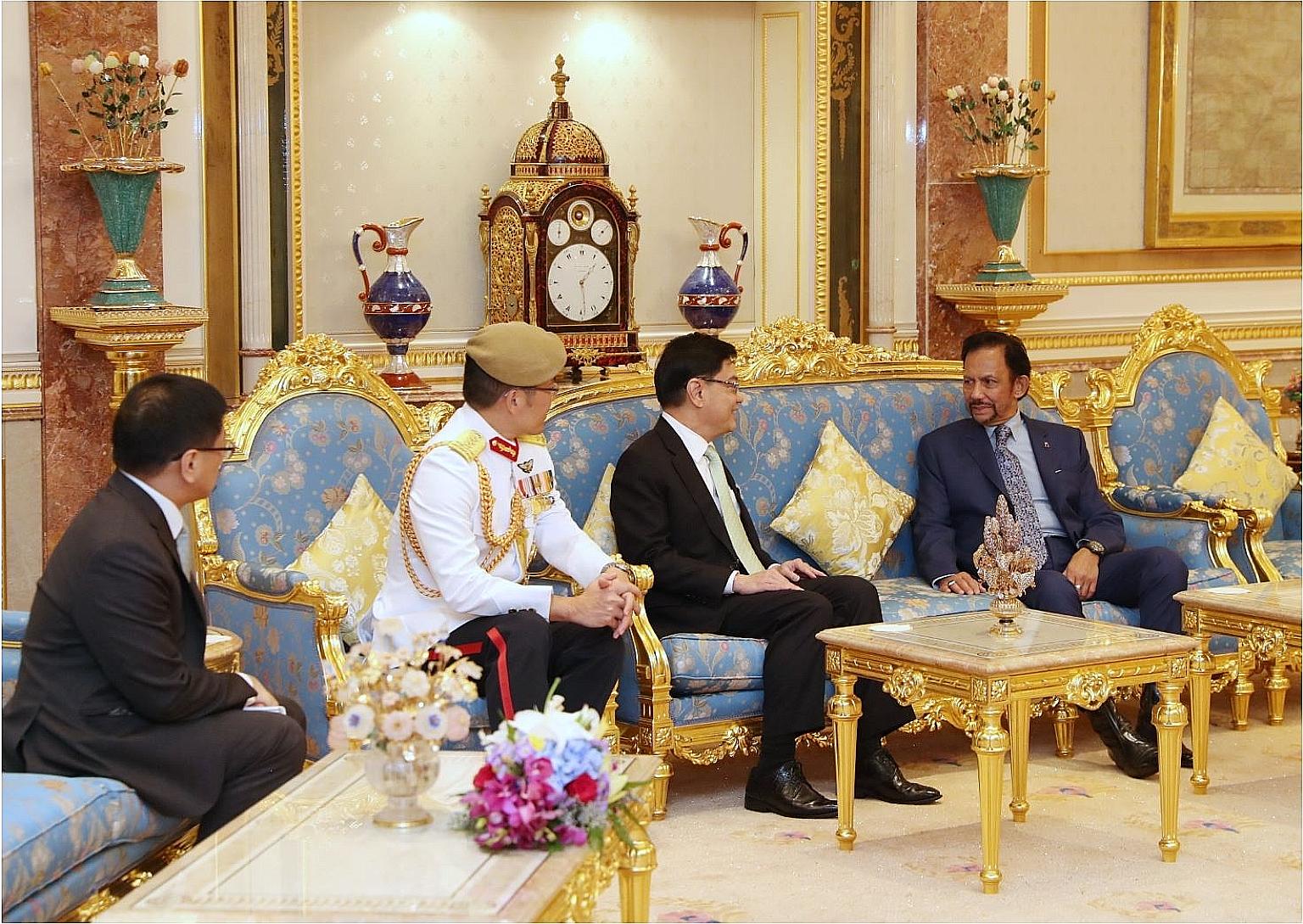 From far left: Singapore's High Commissioner to Brunei Lim Hong Huai, Chief of Defence Force Melvyn Ong, Deputy Prime Minister Heng Swee Keat and Brunei's Sultan Hassanal Bolkiah yesterday.