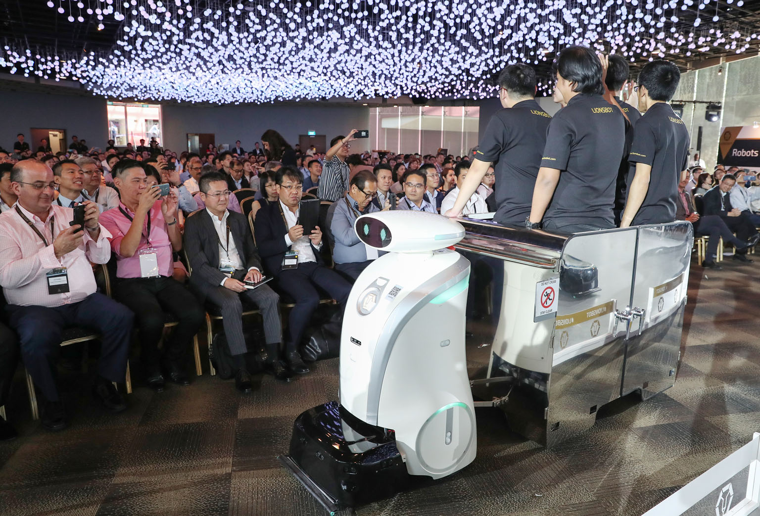 LeoPull, a robot that can transport up to 450kg of cleaning equipment, on show at the launch event yesterday. Local firm LionsBot International has developed 13 different robot models that can scrub, mop, vacuum, sweep, shine and even transport clean