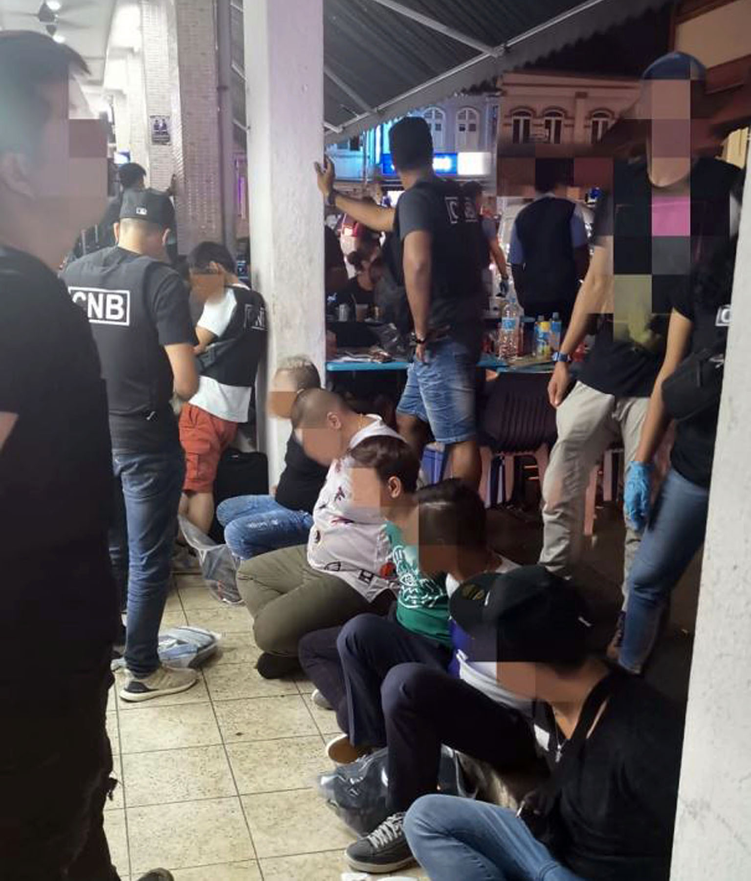 Some of the suspects arrested by CNB officers were allegedly involved in drug trafficking. PHOTO: CNB
