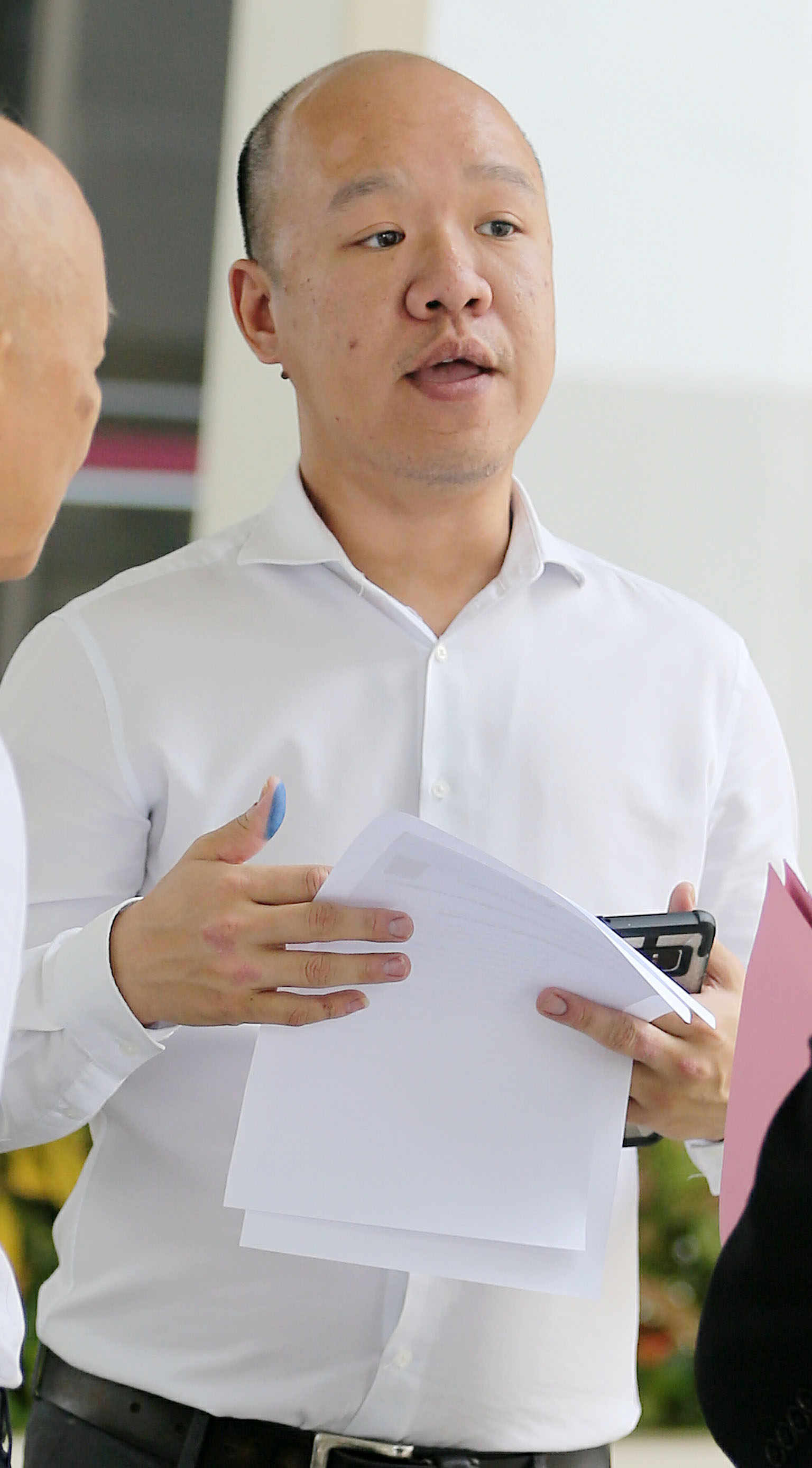 Victor Chin ignored a sign at a bridge telling e-scooter riders to "dismount and push". ST PHOTO: WONG KWAI CHOW