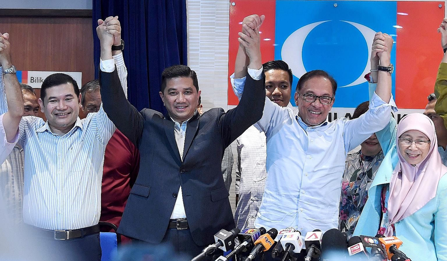PKR president Anwar Ibrahim and PKR deputy president Azmin Ali, with PKR vice-president Rafizi Ramli (far left) and Mr Anwar's wife, Deputy Prime Minister Wan Azizah Wan Ismail, at a press conference on the Port Dickson by-election at the party's hea