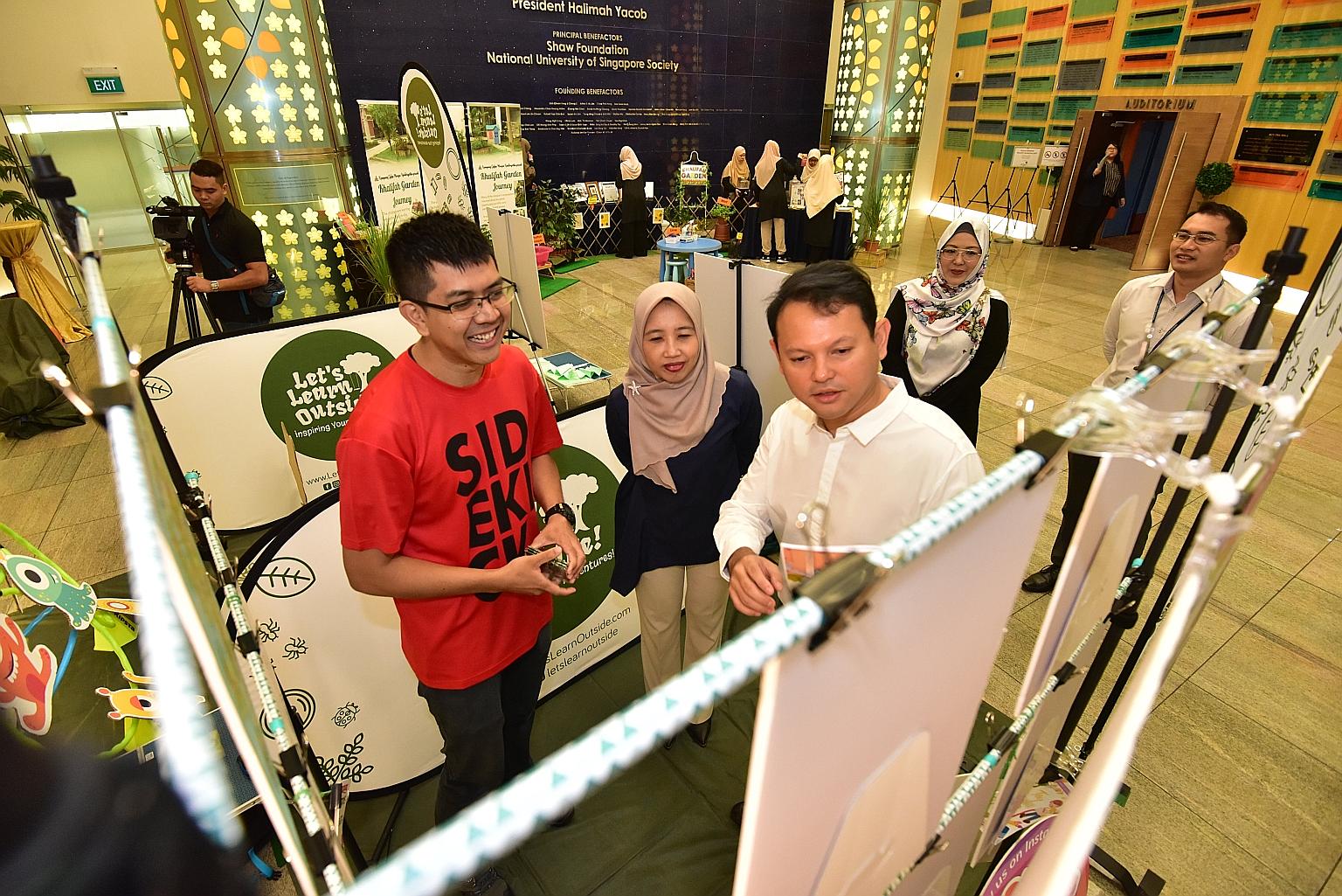 Minister of State Zaqy Mohamad (centre in white) at the Mendaki Education Symposium 2019 on Saturday. The day-long event was for early childhood education stakeholders to meet and learn from one another.