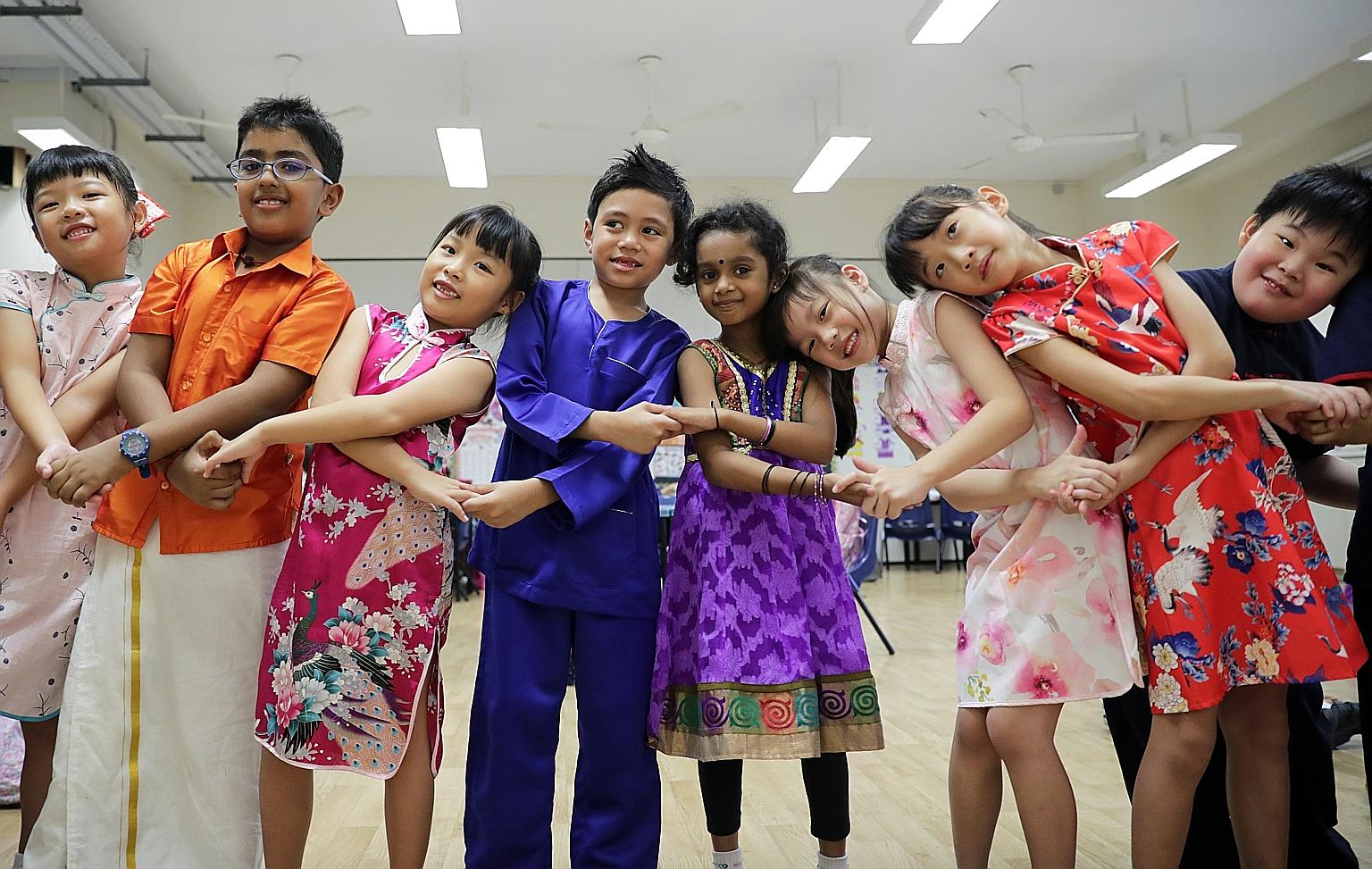Pupils of Westwood Primary School celebrating Racial Harmony Day at school yesterday. Racial Harmony Day, which falls on July 21, was launched by the Ministry of Education in 1997 as part of the National Education programme. Commemorated annually by