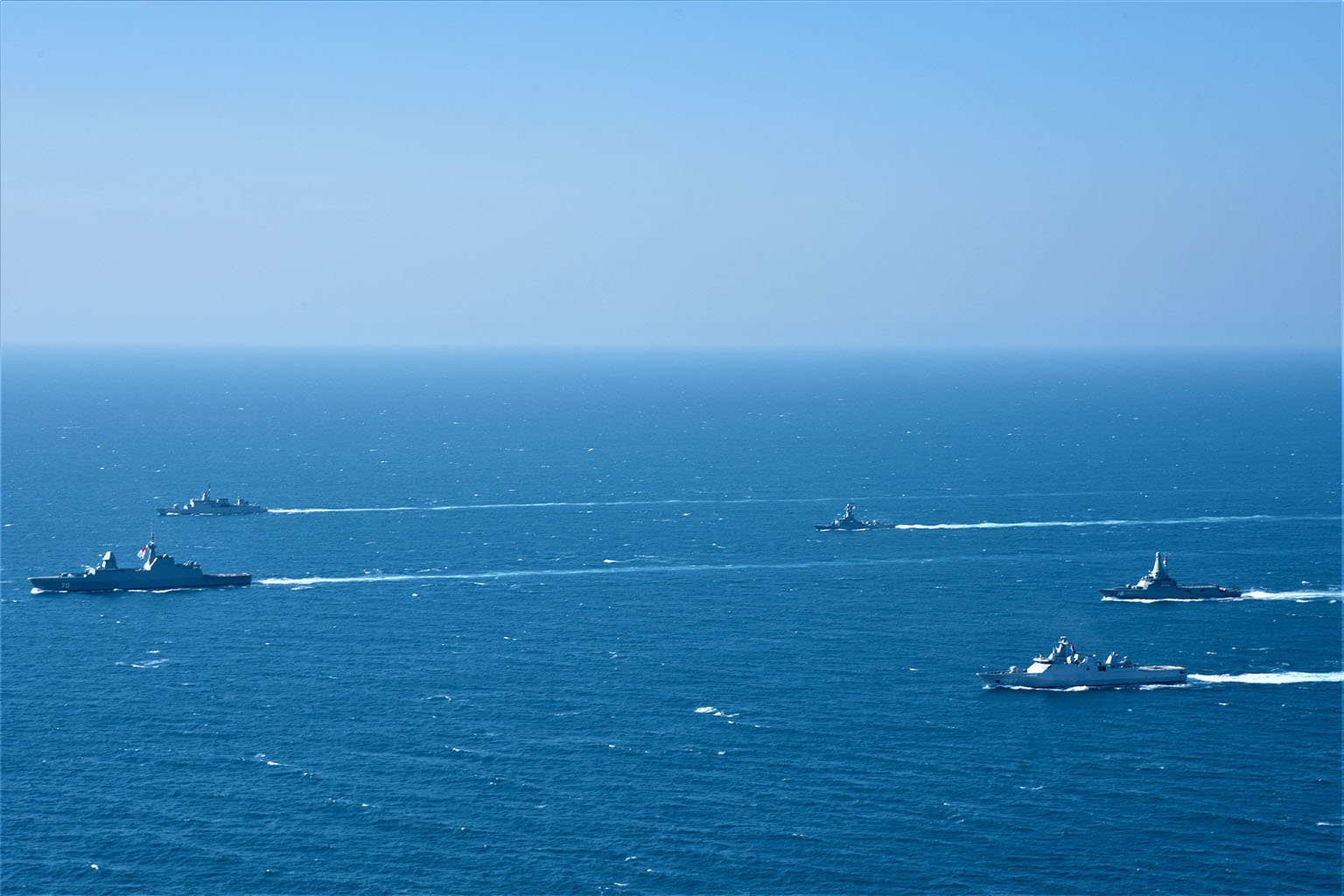 Singapore and Indonesian navy vessels sailing in formation during the 25th edition of Exercise Eagle Indopura, the Singapore Armed Forces' longest-running bilateral exercise with a foreign military.