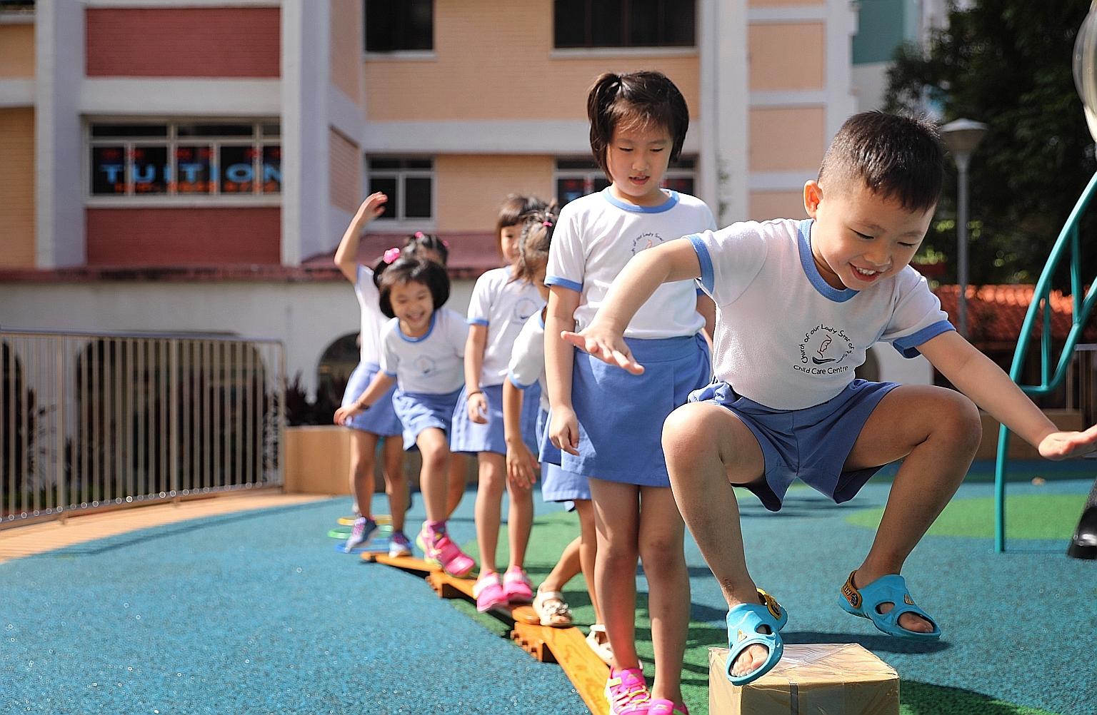 Children from Our Lady Star of the Sea Child Care Centre in Yishun at the outdoor playground last Tuesday. The school's enrolment has held steady at around 85 children in the past few years, but it used to have about 100 children a decade ago.