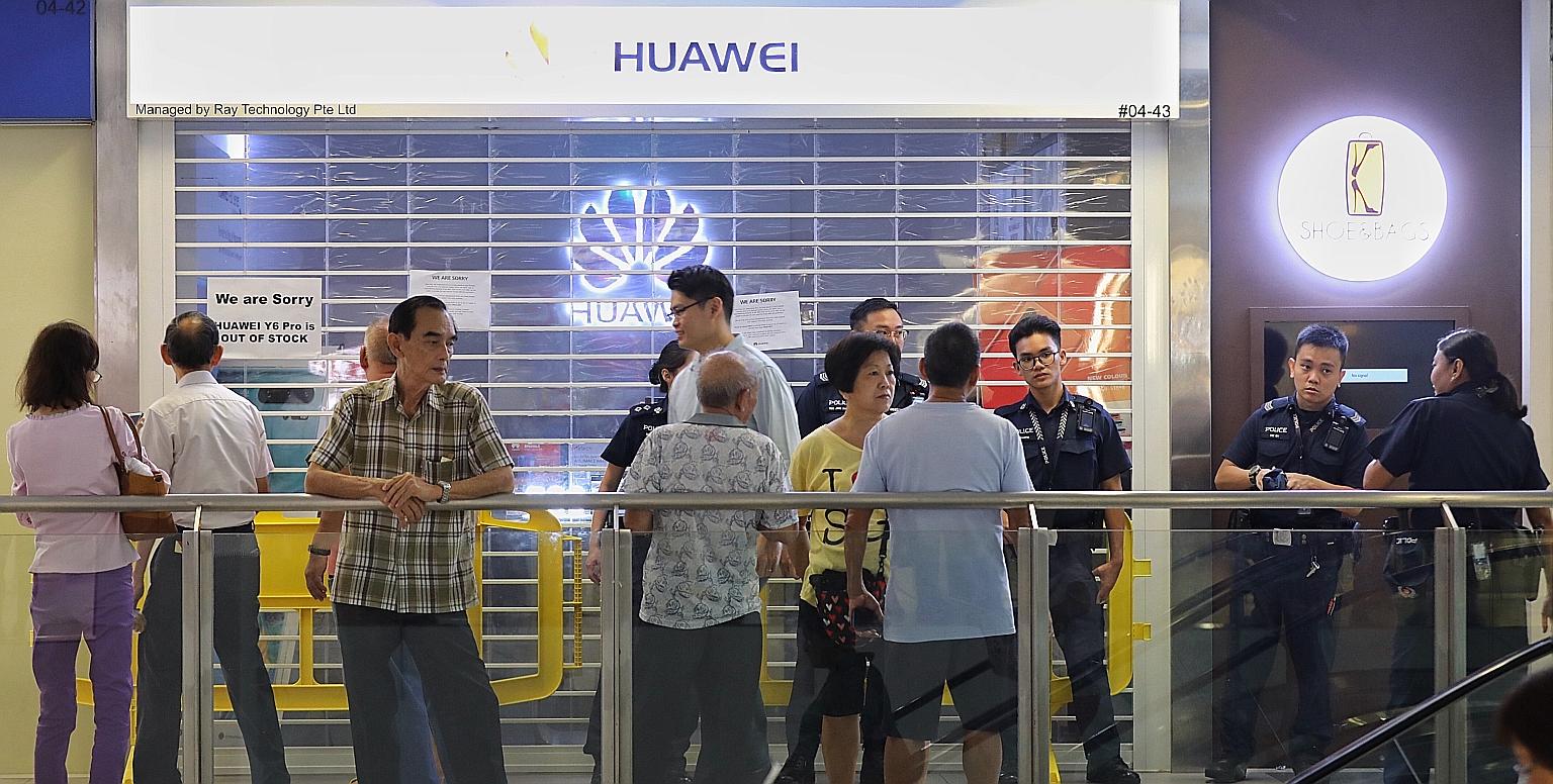 Some members of the public seen outside the Huawei store at Nex shopping mall in Serangoon on Friday. Many consumers who queued up for the Huawei Y6 Pro were disappointed and angry. Huawei has apologised for the insufficient supply, saying it had rec