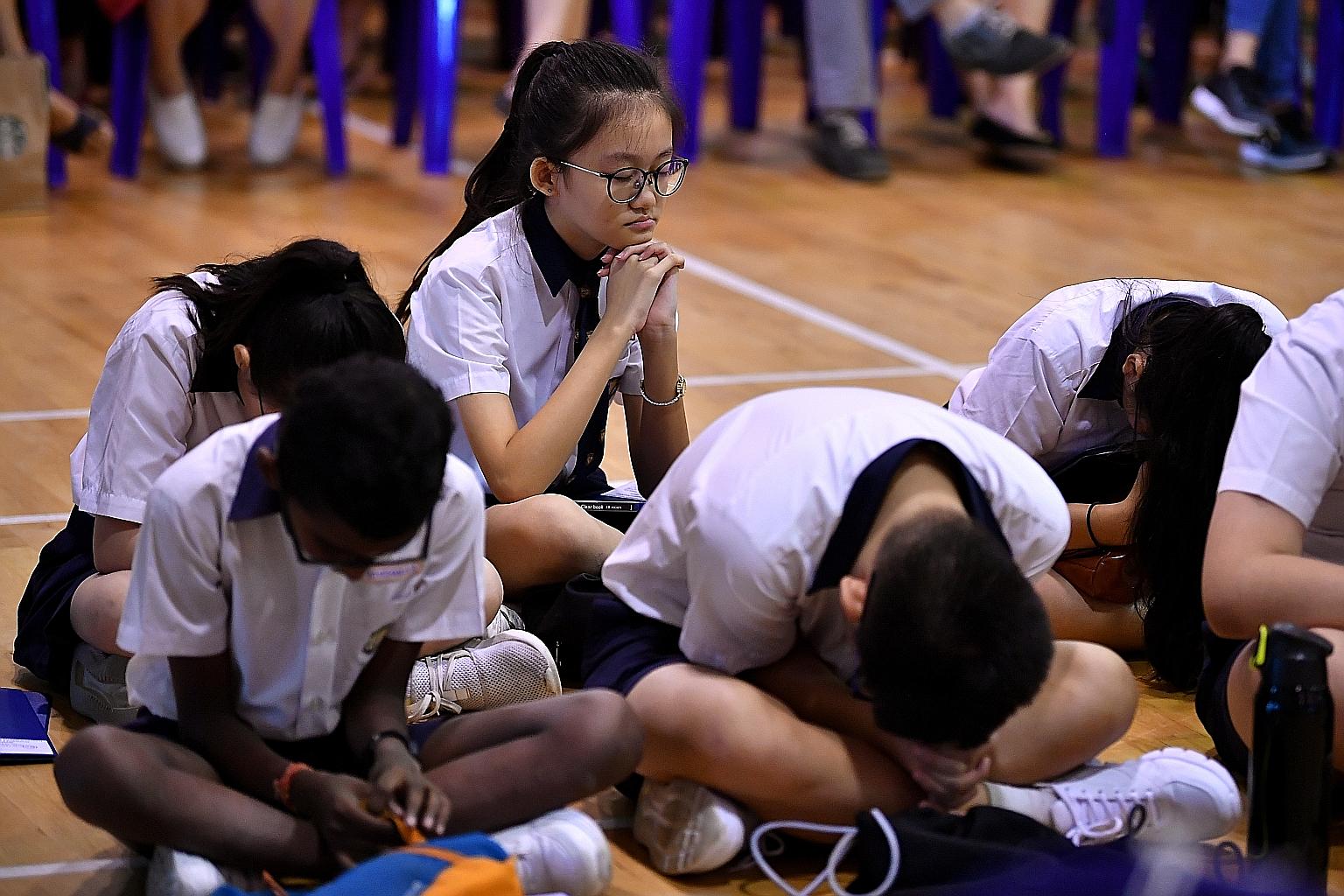 Pupils waiting for the release of their PSLE results last year. Parents have expressed concern over Foundation-level subjects under the new PSLE scoring system, but MOE has made it clear that while the 2021 scoring system is doing away with pinpoint