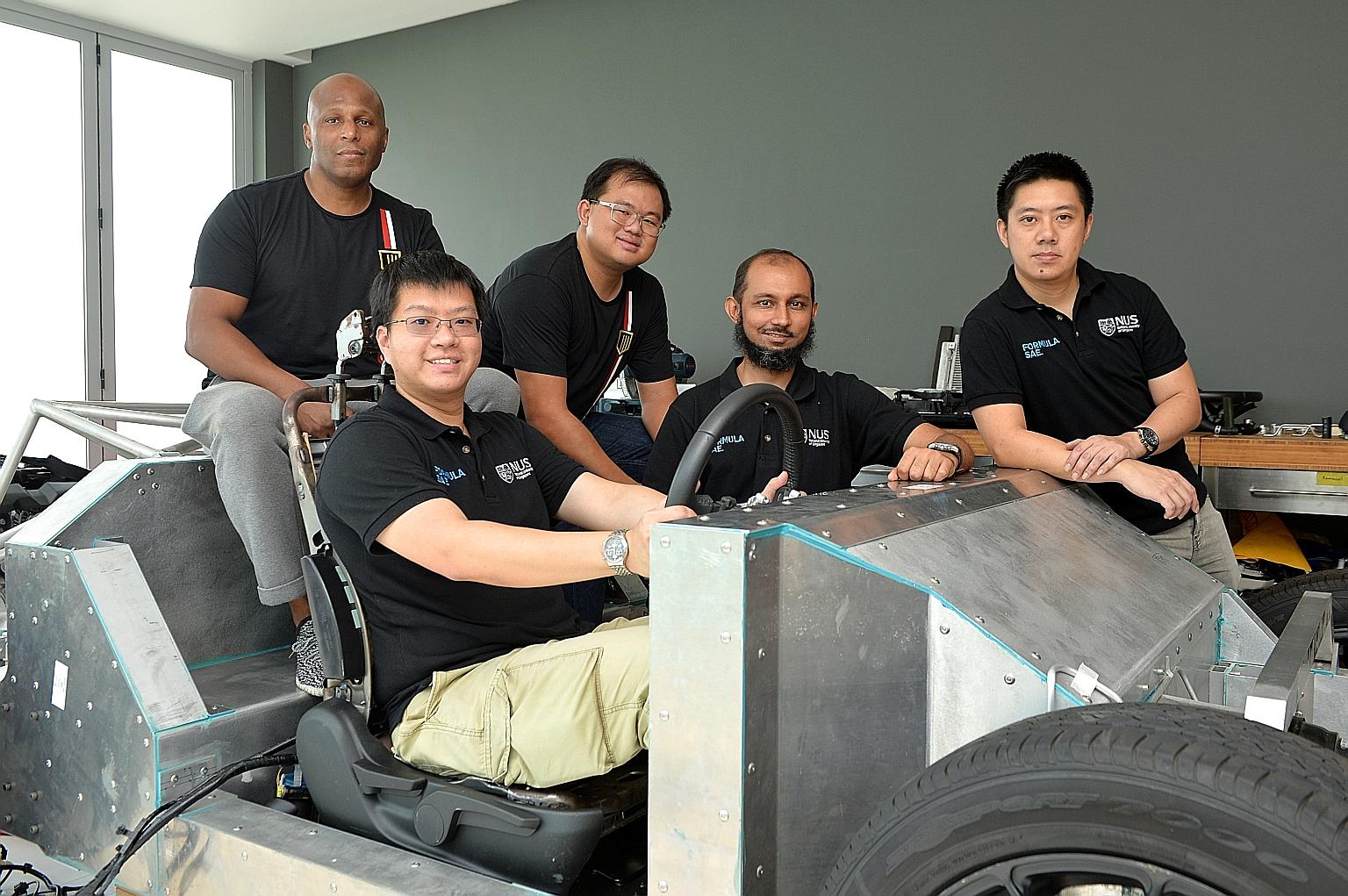 (From left) Catalyst Motors co-founder Anthony Parks, NUS engineer Kenneth Neo Kang Wei, Catalyst Motors design engineer Lim Chin Khiong, and NUS engineers Hozefa Husainee and Lim Hong Wee with the rolling chassis that the firm will use for its proto