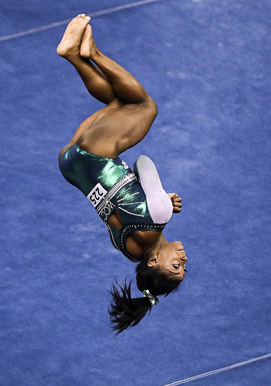 Simone Biles in another jaw-dropping manoeuvre during the US Gymnastics Championships in Kansas City on Friday. If she completes the triple double in Stuttgart in October, the trick will forever be known as the Biles II. PHOTO: REUTERS