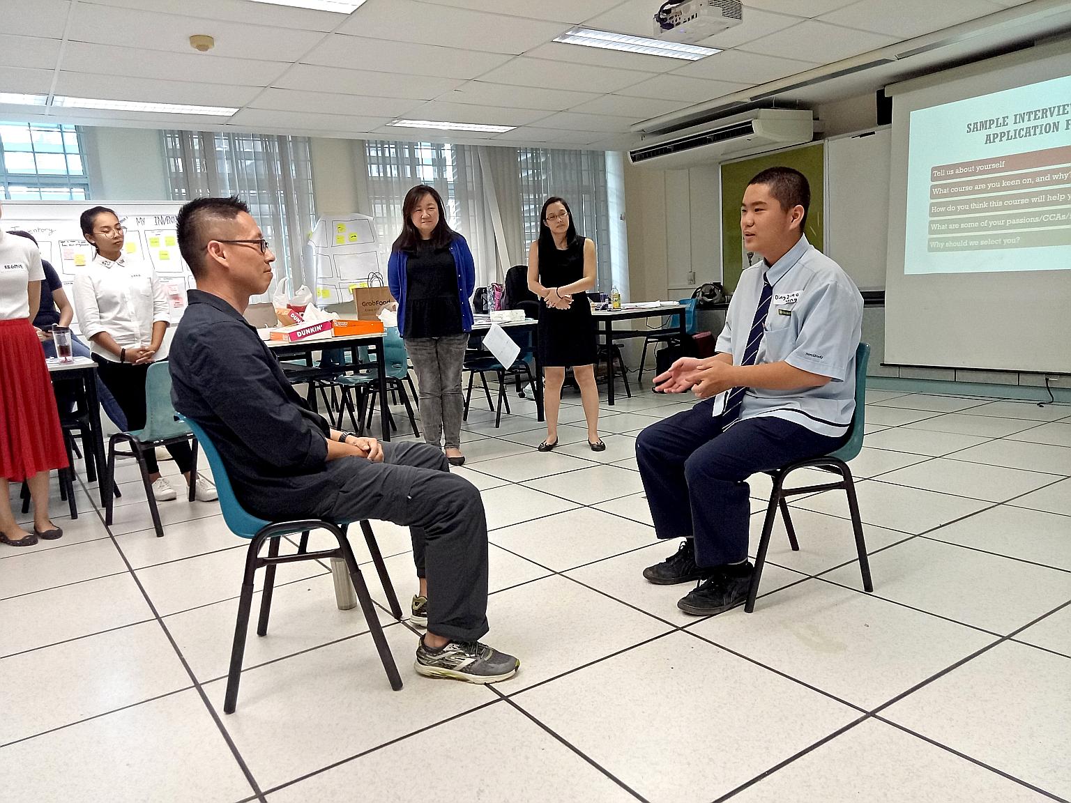 Northbrooks Secondary School principal Nick Chan (left) doing a mock interview with Secondary 3 student Ding Zhao Yang in a workshop organised by Access. The group's pilot run in June involved 19 students.