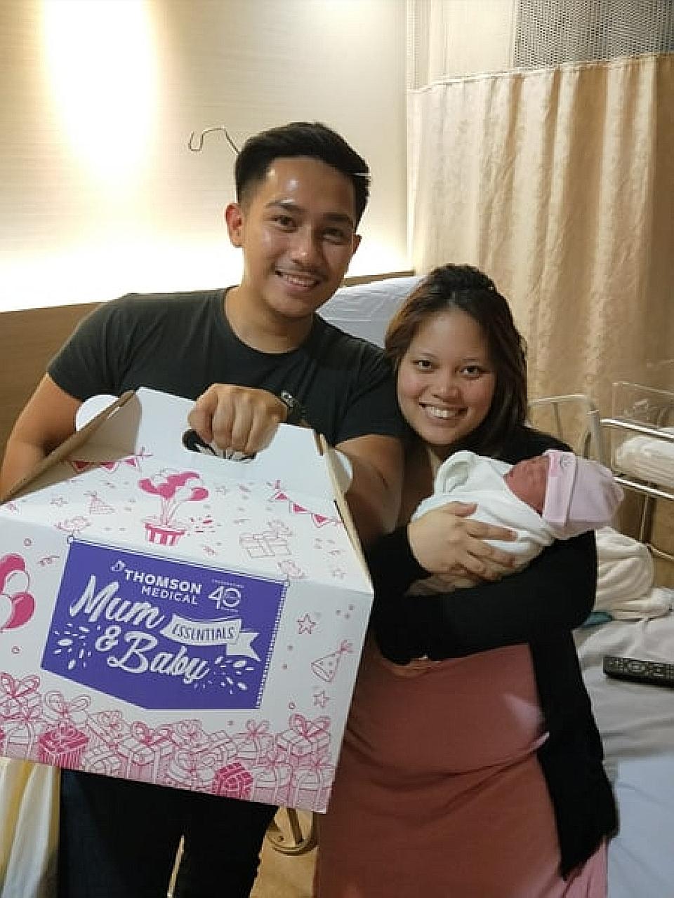 Left: Mr Kamarulnizam Kiman and Ms Nur Syazwani Muhammad Rosdi with their daughter Mia. Below: Mr Kamarulnizam cradling the infant in the Grab car she was born in last Wednesday on the way to the hospital for her delivery. PHOTOS: LIANHE ZAOBAO, KAMA