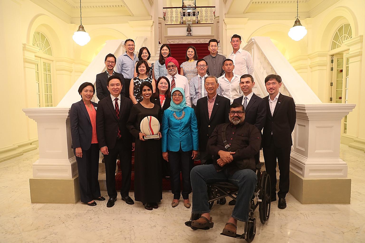 President Halimah Yacob at the awards ceremony for the Singaporean of the Year 2018 earlier this year. Front row, from left: UBS head of Asean equities Yeoh Choo Guan; UBS Asia-Pacific president Edmund Koh; Singaporean of the Year 2018 winner Siti No