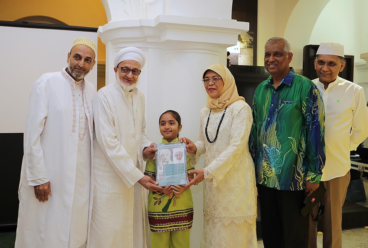 From left: Mr Shaikh Tayebali Khumusi, Mr Mazher Tayeb, Rashida Khumusi, President Halimah Yacob, Mr Naseer Ghani, secretary of the Nagore Dargah Indian Muslim Heritage Centre, and Mr Abdul Jaleel, the centre's chairman, at yesterday's event thanking