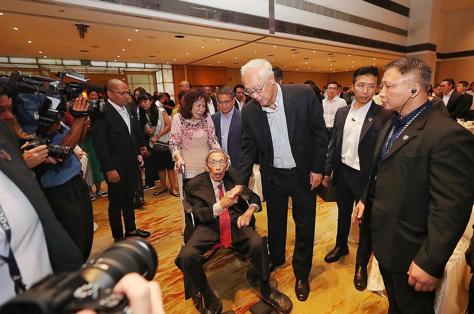 Emeritus Senior Minister Goh Chok Tong greeting Mr Chiam See Tong at last night's Chiam See Tong Sports Fund gala dinner. Mr Chiam made a surprise appearance midway through the event when he was wheeled in by his wife Lina. Also there to greet Mr Chi
