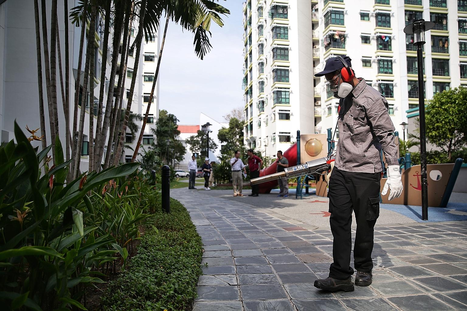 A pest-control officer carrying out misting on the premises of Eastvale Condominium on Aug 5. According to the National Environment Agency's website, there were 525 dengue cases in the second week of this month.