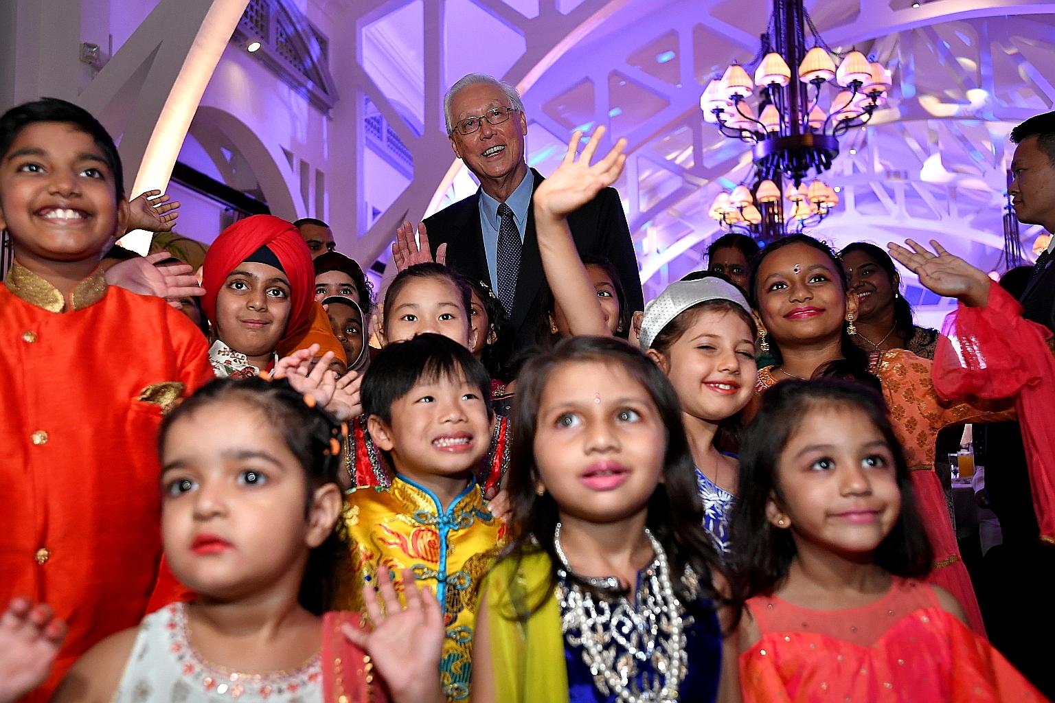 Emeritus Senior Minister Goh Chok Tong, patron of the Inter-Religious Organisation (IRO), with children from the 10 major religions represented by the IRO, at the organisation's 70th anniversary dinner yesterday.
