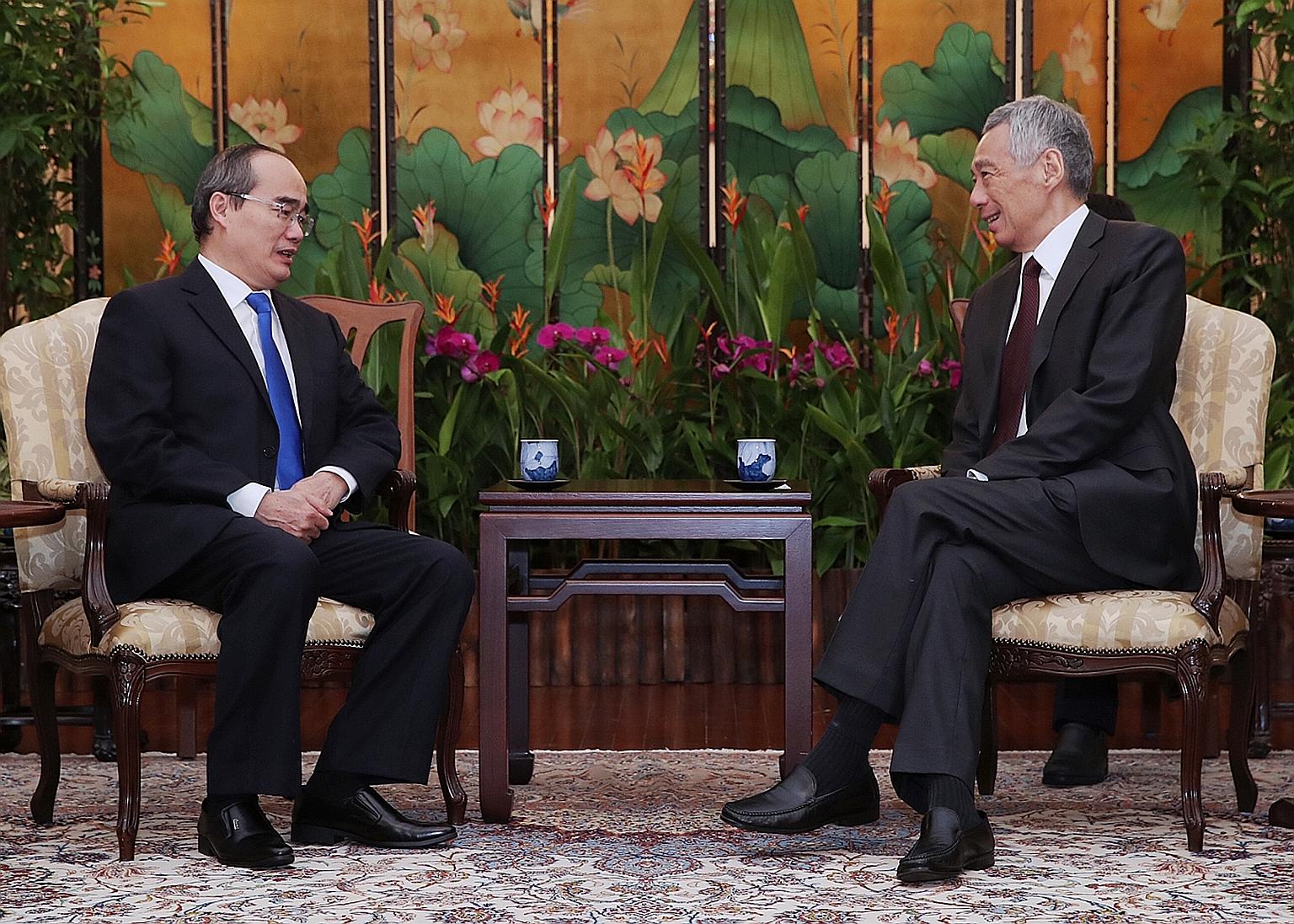 Dr Nguyen Thien Nhan, Secretary of the Party Committee of Ho Chi Minh City, with Prime Minister Lee Hsien Loong at the Istana yesterday. PHOTO: MINISTRY OF COMMUNICATIONS AND INFORMATION