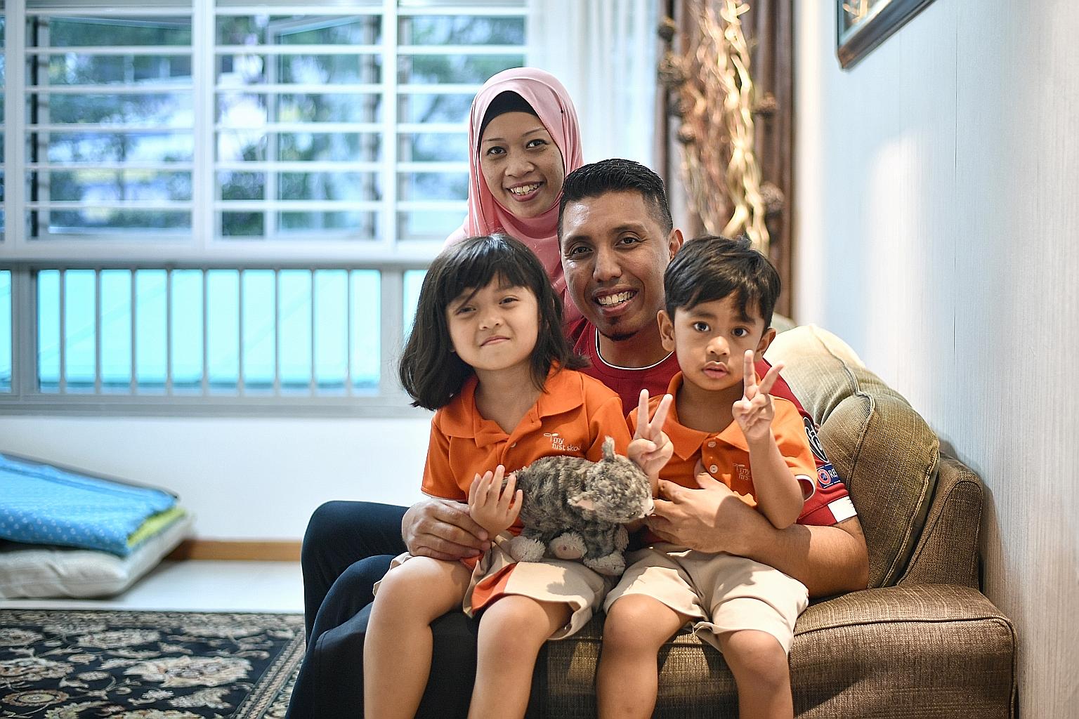 Safety officer Mohammad Faizal Jaafar and bank executive Nurkaramariah Aman with their daughter Dhia Umairah, five, and son Adam Naufal, three.