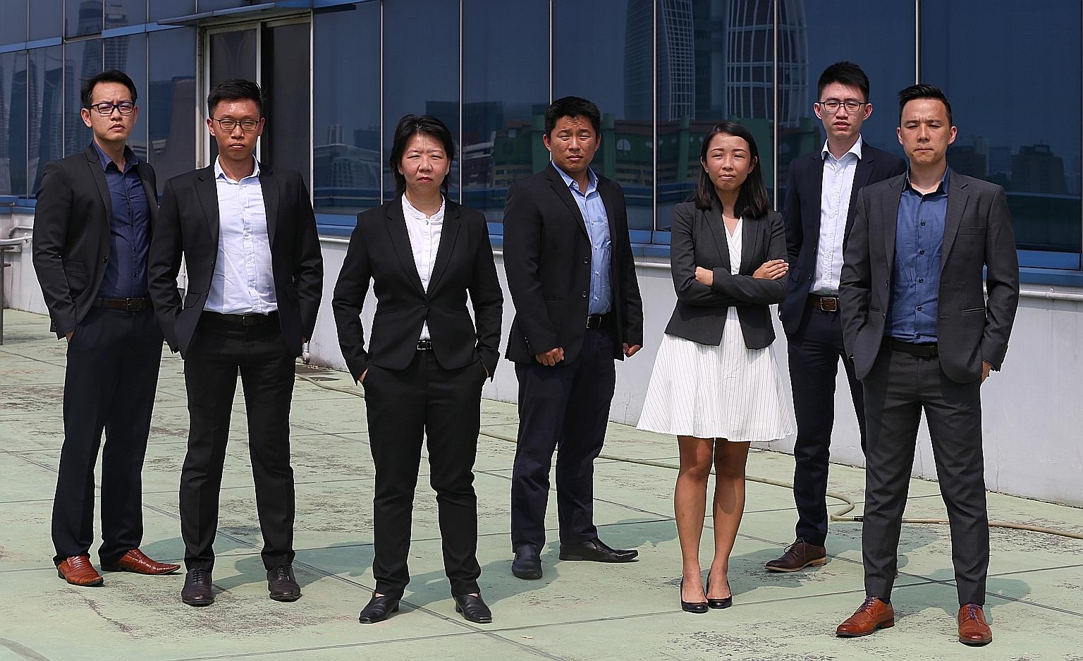 Deputy Assistant Commissioner Aileen Yap (third from left), assistant director of the Specialised Commercial Crime Division in the Commercial Affairs Department, with the team of six officers across various departments in the police who helped set up