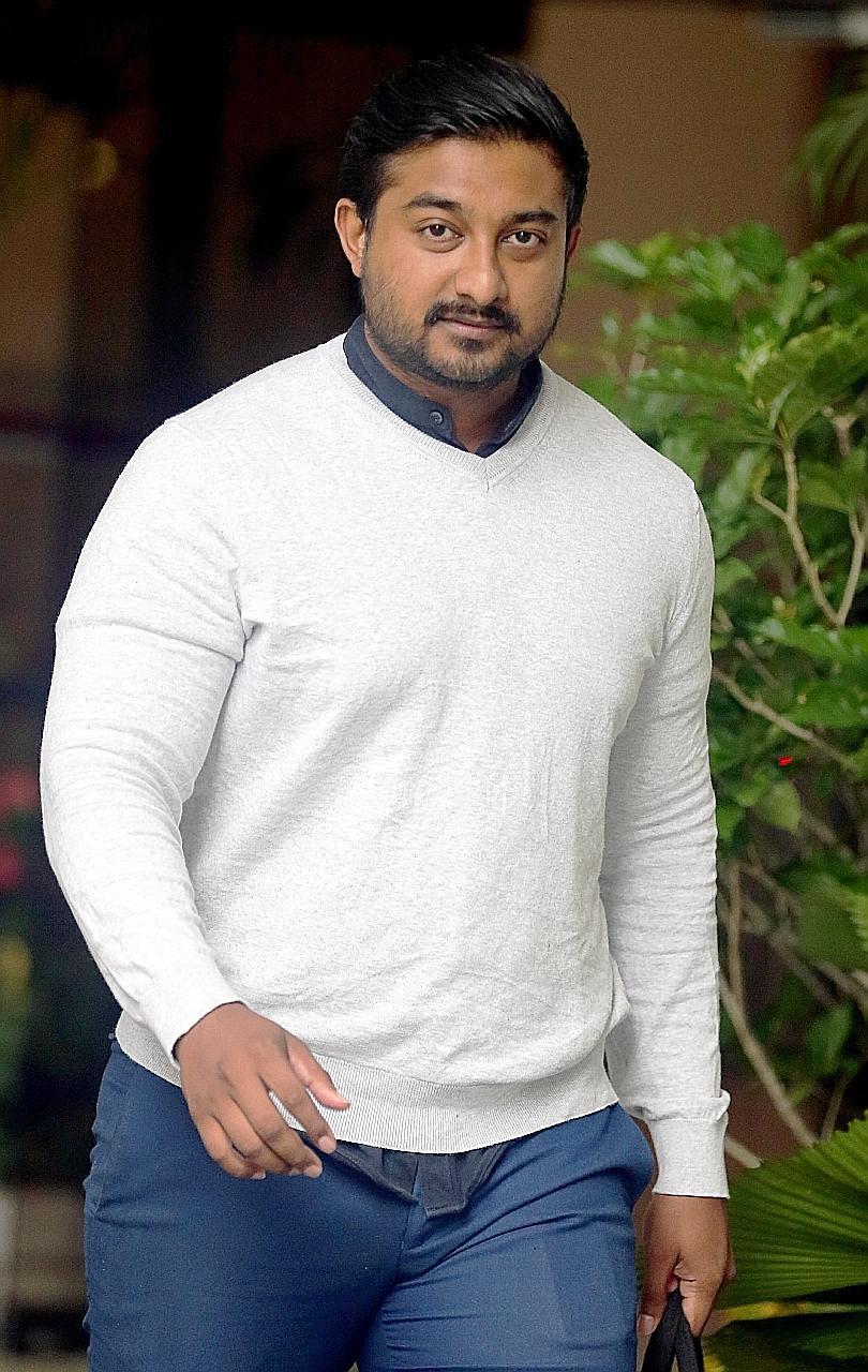 Fazli Hisham Mohd Fairuz Shah, who was fined $3,000 yesterday, had received the photo of the dead maid from his girlfriend, a paramedic. ST PHOTO: WONG KWAI CHOW