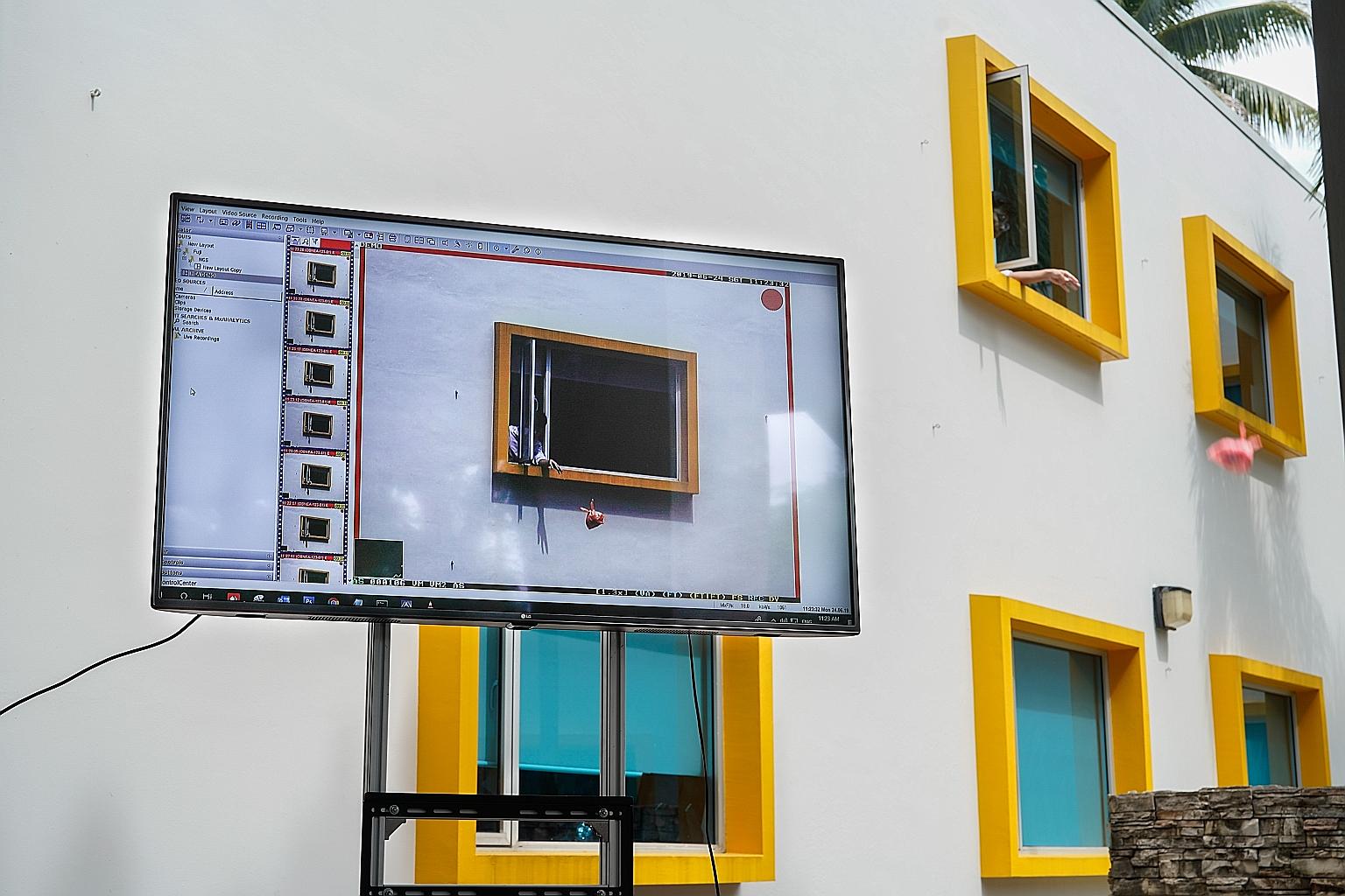 A demonstration of how the National Environment Agency's surveillance cameras can capture someone throwing rubbish out of the window. The cameras helped catch more than 2,200 high-rise litterbugs between August 2012 and December last year, of whom 52