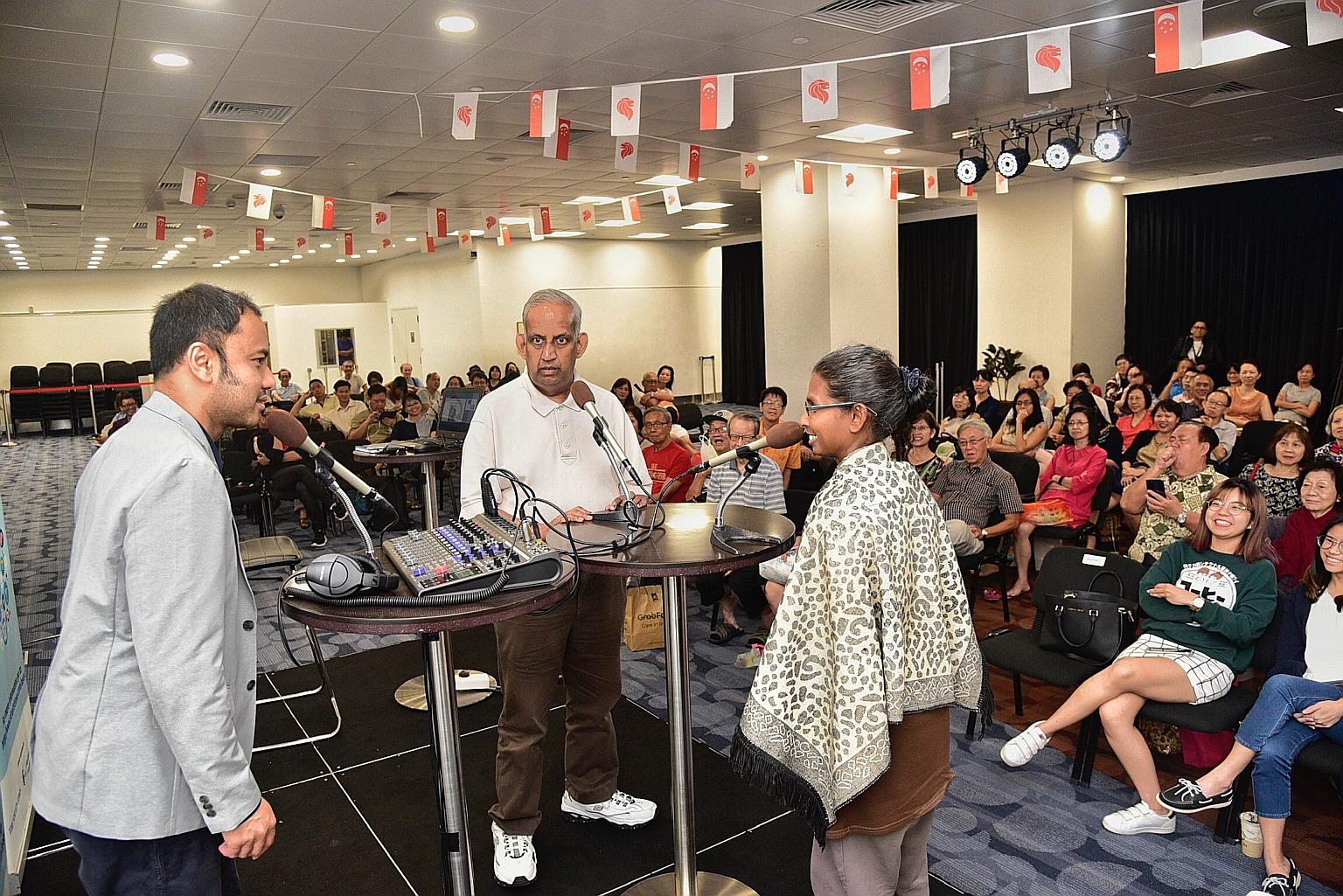 Mr Ernest Luis (far left), head of SPH podcast productions, recording a podcast on stage with Mr R. Jayakumar, a management consultant, and Ms Kamilah Mohamed Anverdeen, a hotel employee, both members of the audience.