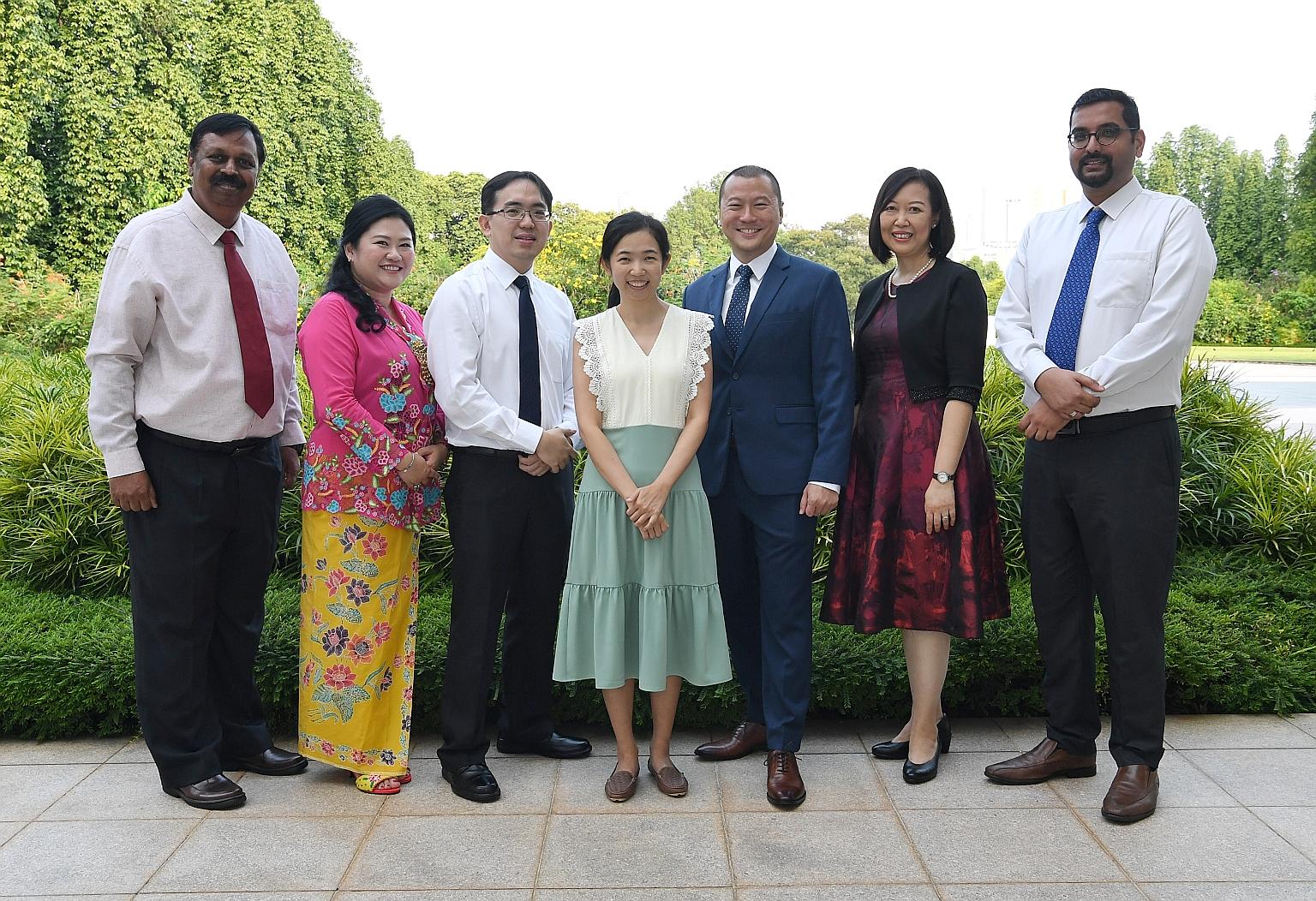 At the Istana yesterday to receive their award from President Halimah Yacob were (from left) Mr Syam Lal Sadanandan, 54, from Bukit Batok Secondary; Madam Sarah Koh, 41, from Holy Innocents' Primary; Mr Victor Chew, 37, from Rosyth School; Dr Koh Noi
