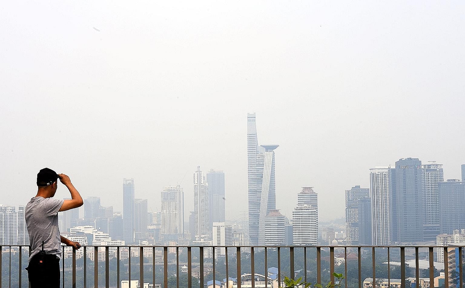 Air quality hit unhealthy levels in several parts of Malaysia yesterday, including Kuala Lumpur (right) and Sarawak, next to West Kalimantan. Indonesia is battling a surge in the number of hot spots, and thick smoke and dry conditions are expected to