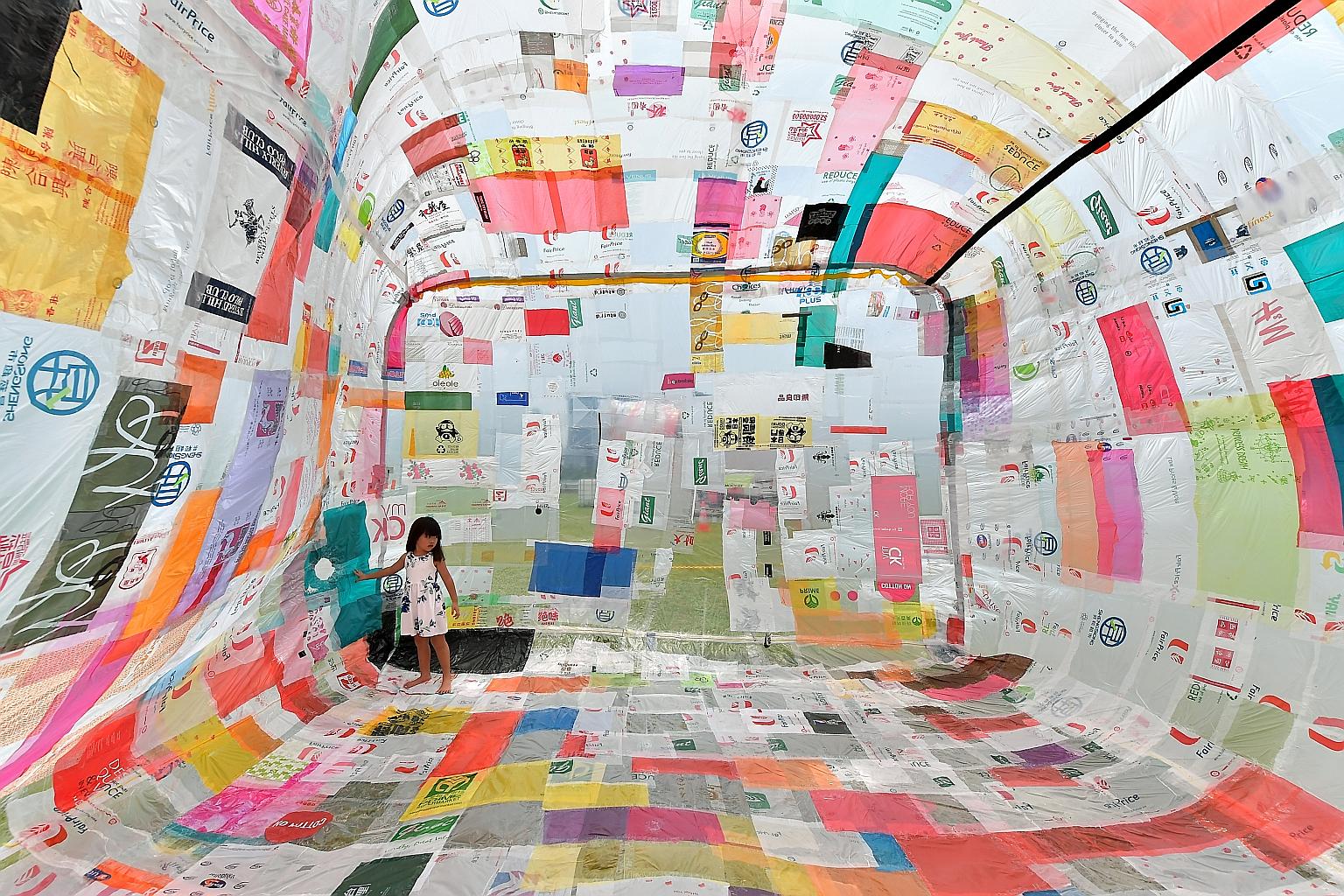 A girl playing inside Museo Aero Solar, a large artwork made up of over 500 plastic bags. The balloon-like installation, launched by the ArtScience Museum at Marina Barrage last Saturday, is the culmination of a four-month community outreach project 