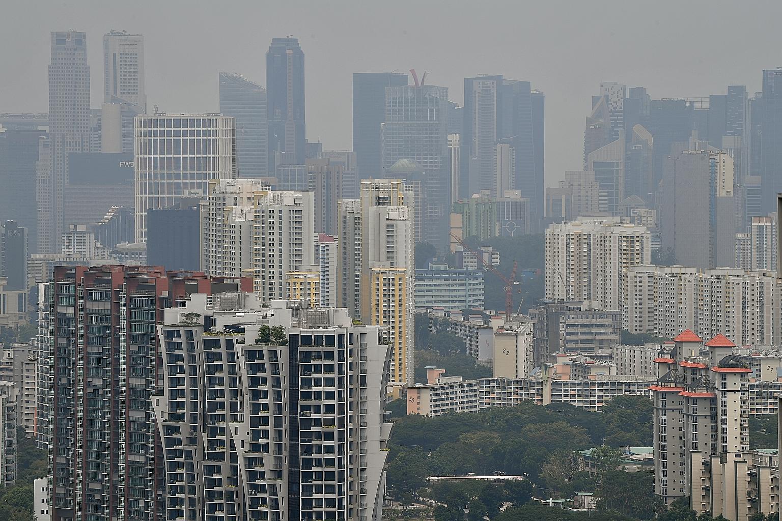 The slightly hazy view of the Central Business District from SkyVille@Dawson at 1.57pm yesterday after the PSI reading at 1pm registered 72. A total of 380 hot spots were detected in Sumatra yesterday, up from 333 on Sunday, said the National Environ