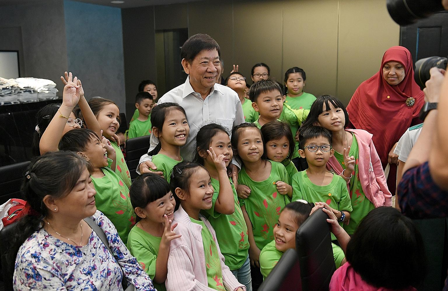 About 60 participants from the Hougang Sheng Hong Student Care Centre yesterday looking at multimedia exhibits that showcase Singapore's cultural history at The Bicentennial Experience at Fort Canning Centre. At the event, Transport Minister Khaw Boo