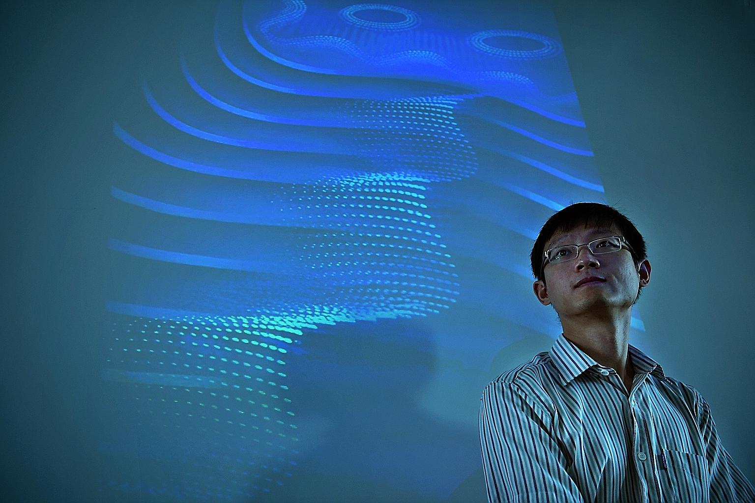 Assistant Professor Yang Shengyuan of the Singapore University of Technology and Design with an illustration of the 3D quantum Hall effect in the background. His team was involved in the first experimental demonstration of the effect in 3D - which pa