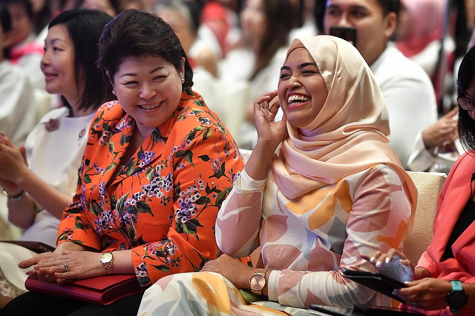 Ms Nabillah Jalal and Ms Susan Chong, who were on the panel at the PAP Women's Wing annual conference yesterday, sharing a lighthearted moment as they were introduced before the discussion. PHOTO: CHONG JUN LIANG