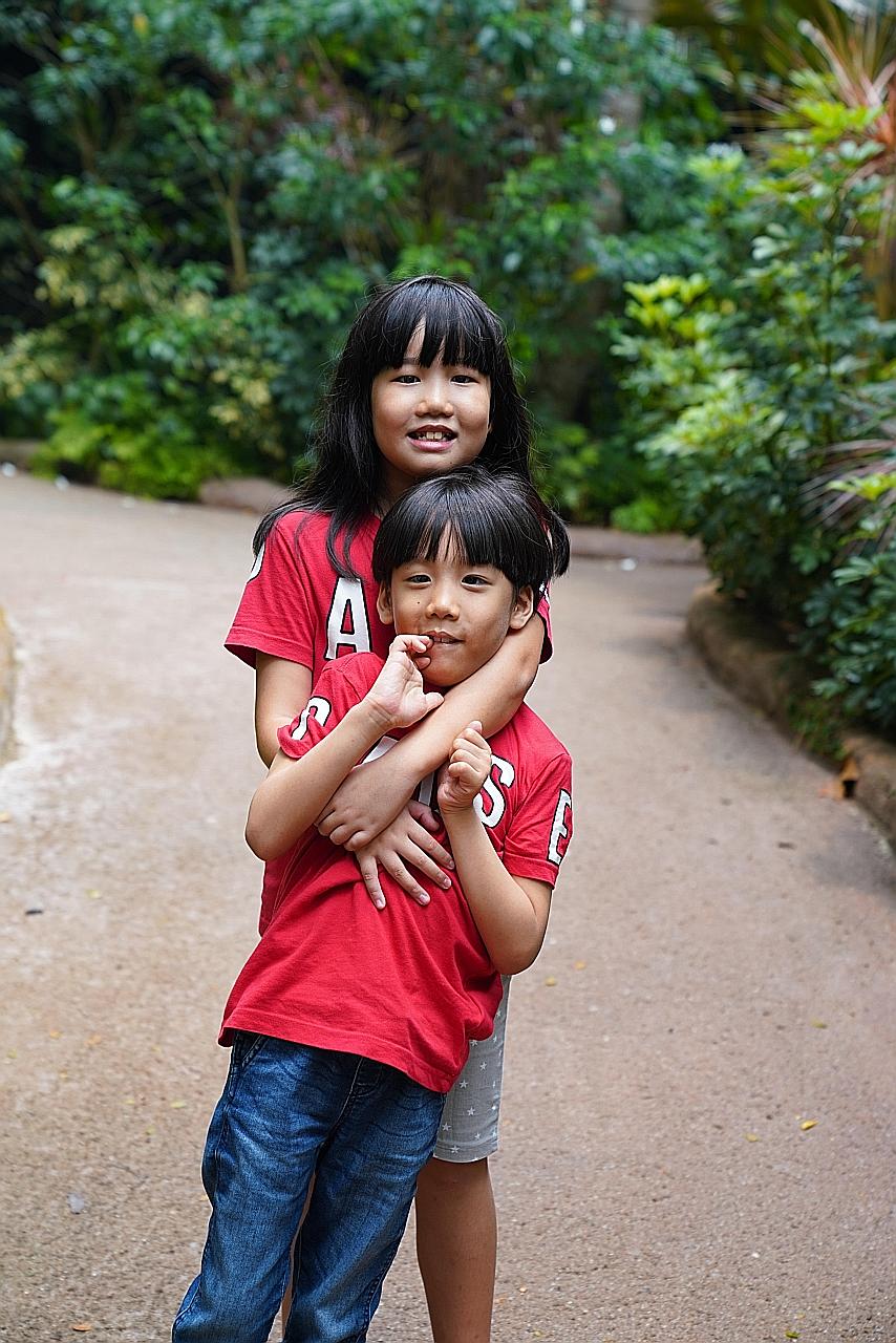 Charmeine Lee Kai En, 10, received an award for being an exemplary sibling to her brother, Bryan Lee Kai Jie, seven.
