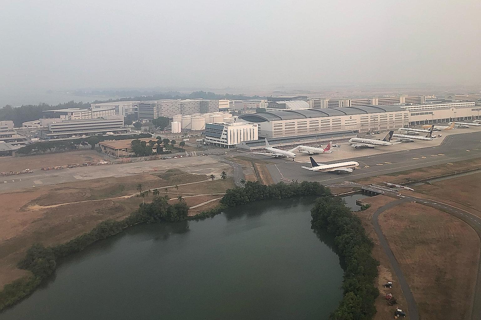 Conditions in the Changi area at 6.30pm yesterday. The 24-hour PSI reading in the east at 7pm was 76 (moderate). Singapore got a breather when the winds changed direction on Sunday to blow from the south-east. ST PHOTO: NEO XIAOBIN