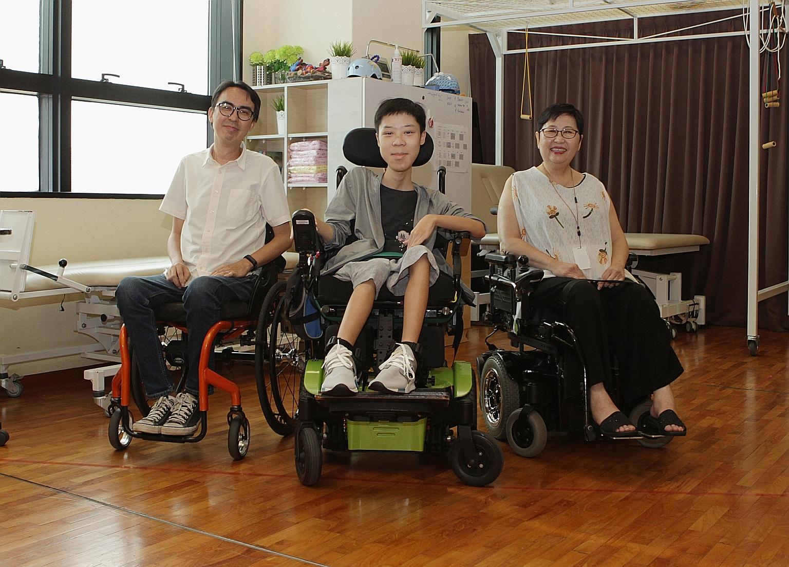 From left: Mr Alvin Seah, 39, Mr Desmond Lam, 19, and Ms Sherena Loh, 59, who all have a form of muscular dystrophy, at the Muscular Dystrophy Association (Singapore). The centre needs more funds to continue running and expanding its programmes, whic