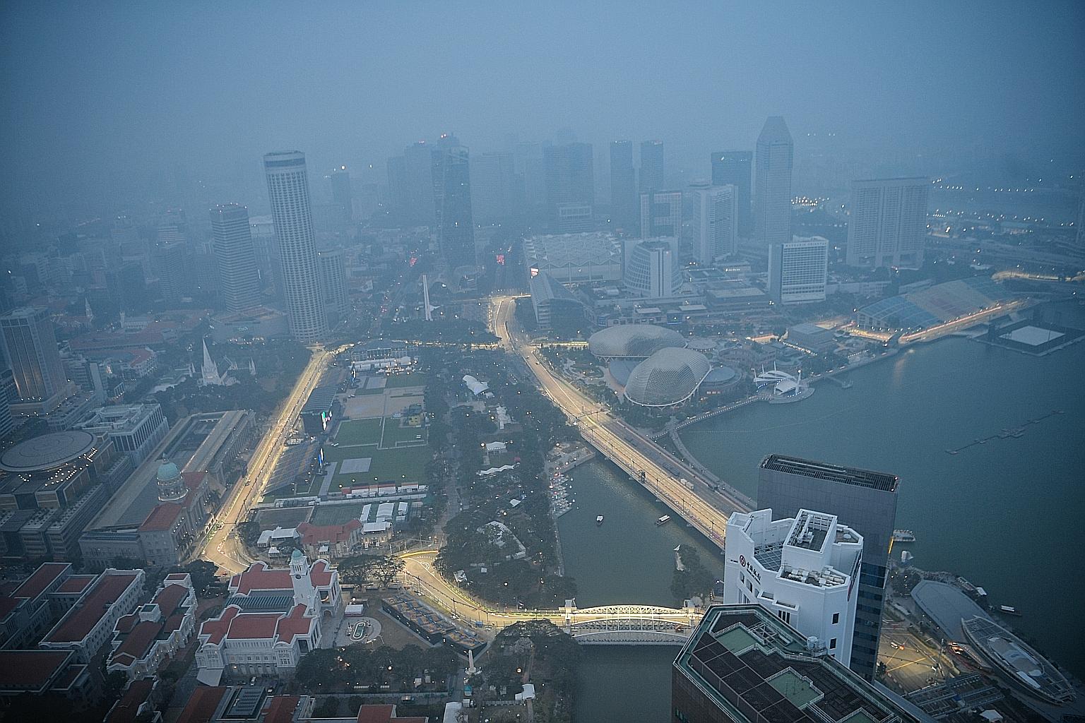 A view of Singapore taken from the 1-Altitude rooftop bar yesterday at around 7pm, when the PSI reading for the central region was 113.