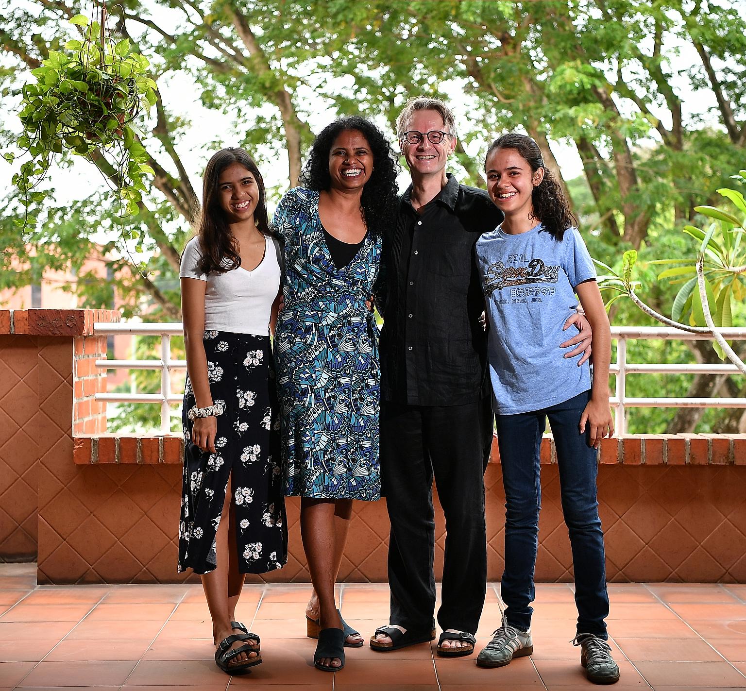 Ms Gloria Pereira, 46, with her husband Torben Kragh Joergensen, 55, and daughters Hannah (left), 17, and Christa, 20.