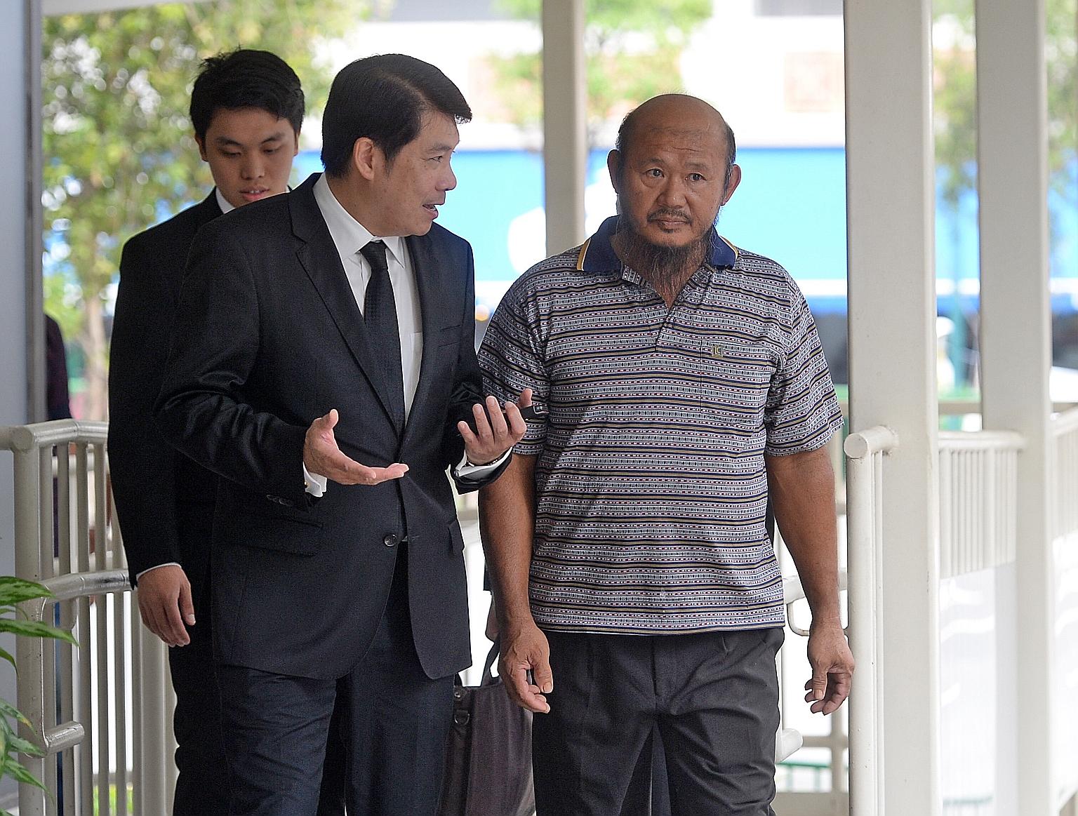 Lorry driver Teo Seng Tiong (right) with his lawyer Chia Boon Teck yesterday. Teo is contesting two charges - of acting rashly as to cause hurt to a cyclist in the incident in Pasir Ris on Dec 22 last year, and of failing to make a police report with
