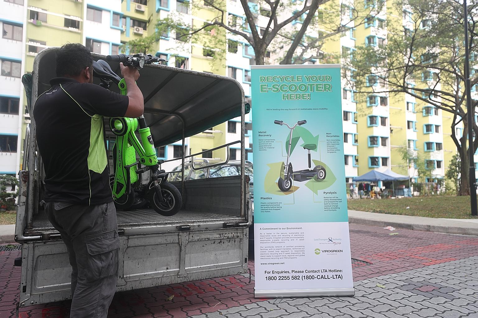 A PMD being loaded onto a lorry at a disposal point near Block 209 Boon Lay Place yesterday. Over six months, till March 31 next year, PMD owners will be able to dispose of their devices at 180 disposal points set up by LTA-appointed e-waste recycler