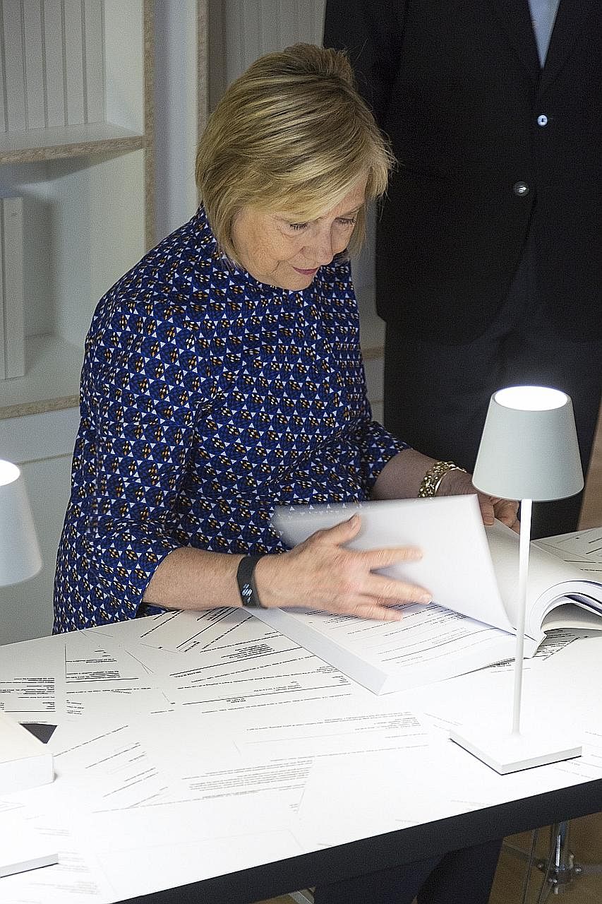 Mrs Hillary Clinton at US artist Kenneth Goldsmith's art exhibition dedicated to her e-mails in Italy this month. Her use of a private e-mail server during her term as secretary of state triggered multiple probes.