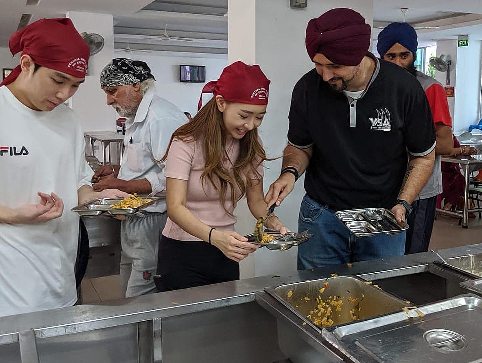 Instagram user Sheena Phua with Mr Sarabjeet Singh, president of the Young Sikh Association, during her visit to the Central Sikh Temple in Towner Road yesterday. She was invited to a gurdwara so she could learn more about Sikh traditions.