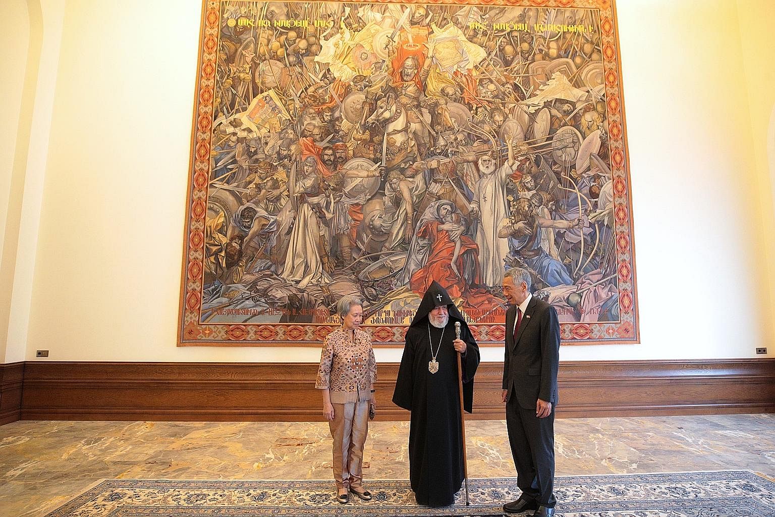 Prime Minister Lee Hsien Loong and Mrs Lee meeting Supreme Patriarch and Catholicos His Holiness Karekin II in his residence yesterday at the Mother See of Holy Etchmiadzin in Armenia, where PM Lee is on an official visit. Behind them is a reproducti