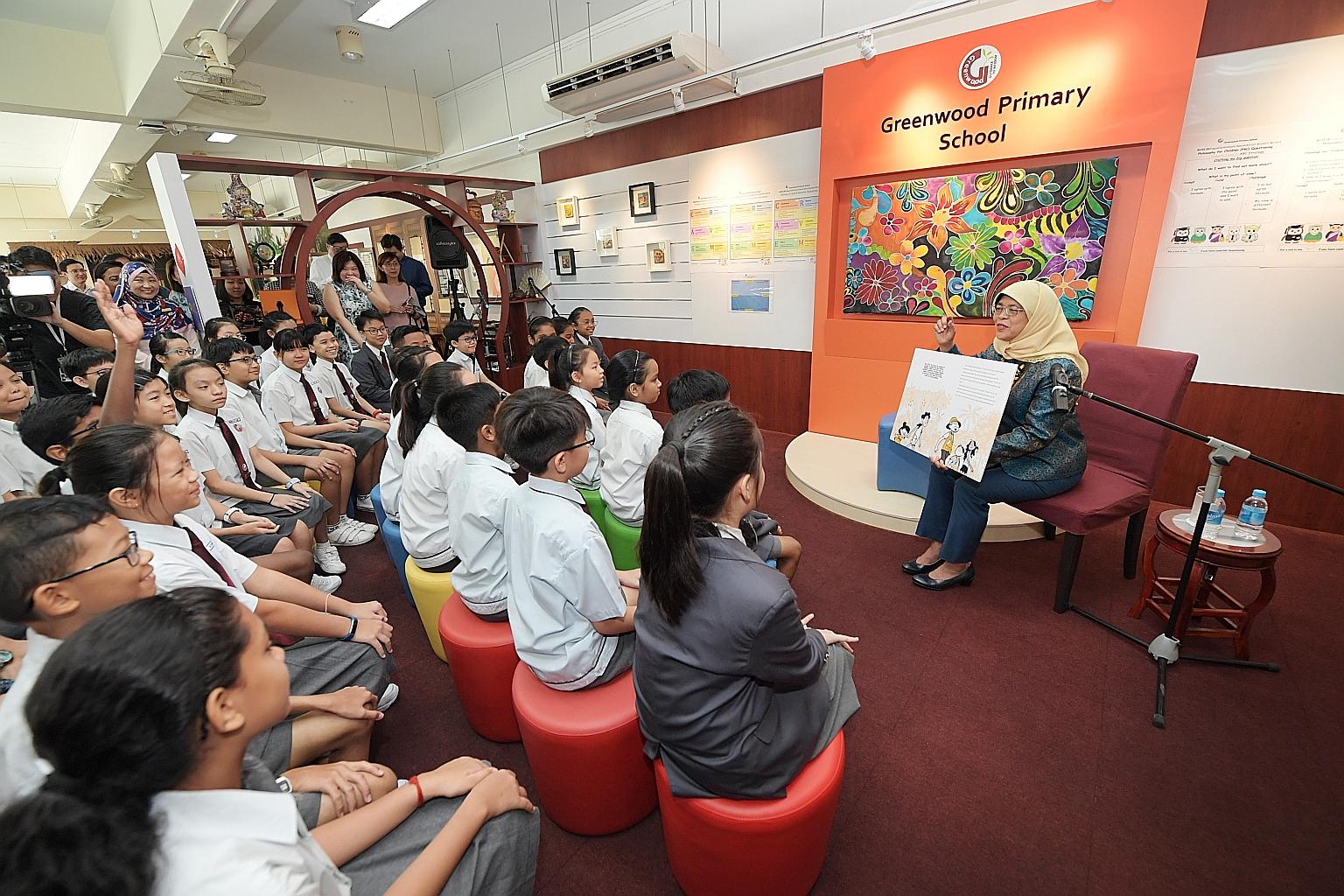 President Halimah Yacob was grilled yesterday by Greenwood Primary School pupils on the Istana. One asked if there were insects. She replied "there are tons of species" and also butterflies and birds. Another asked about the number of rooms in the Is