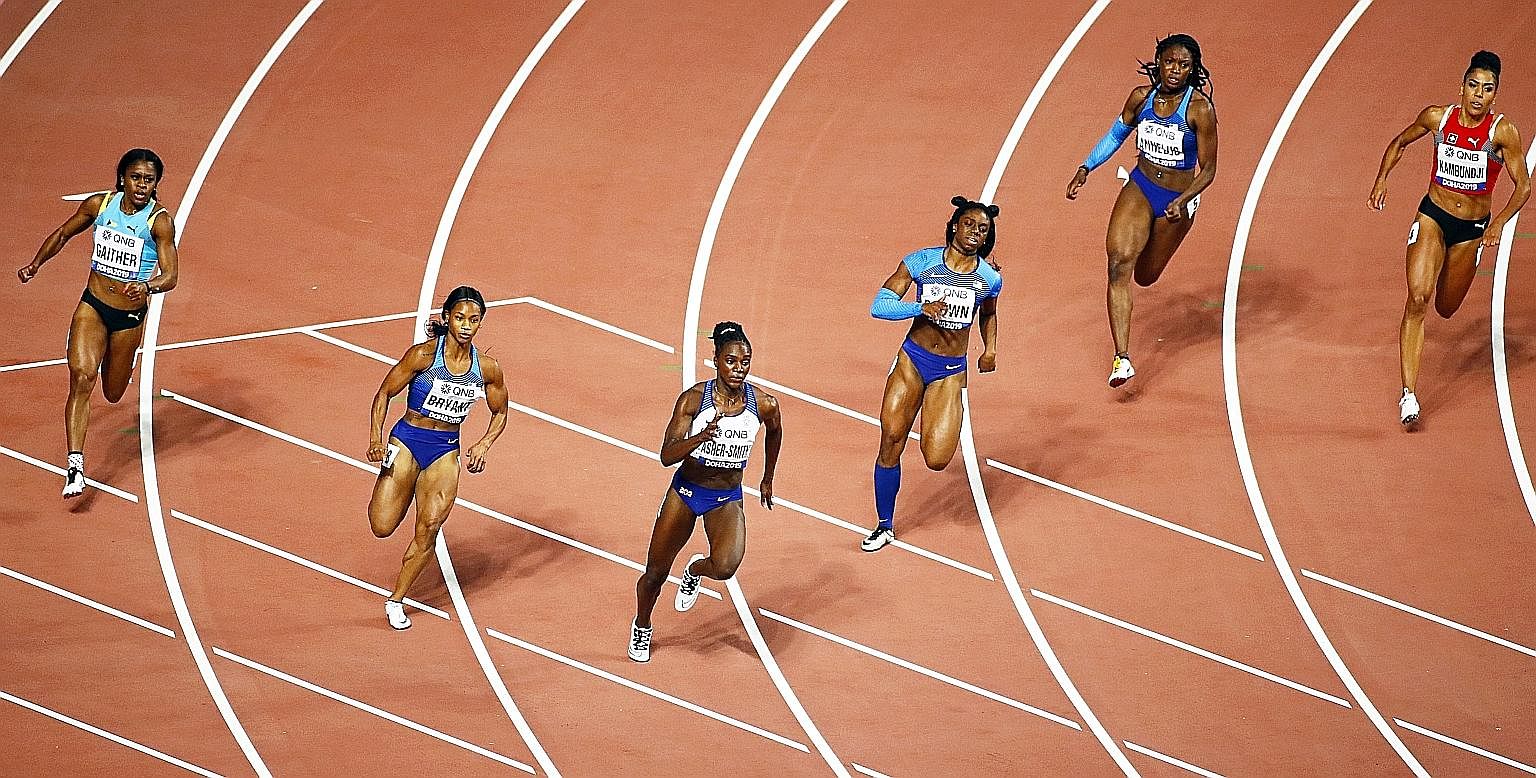 Dina Asher-Smith (third from left) of Britain on her way to winning the women's 200m final at the World Athletics Championships in Doha. Her time of 21.88sec is a British record. PHOTO: EPA-EFE